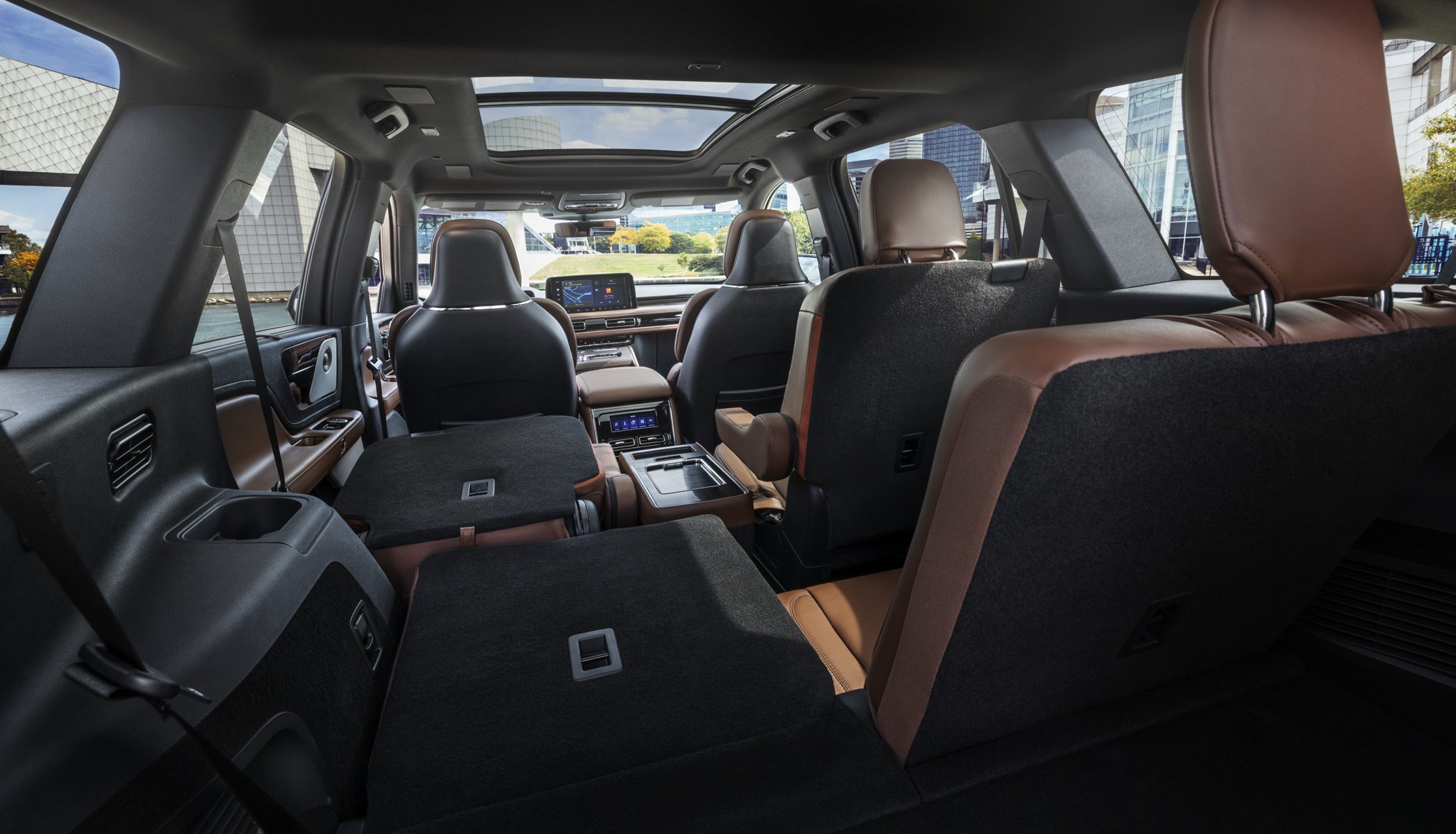 One side of the PowerFold® third-row seat and a second-row seat are folded forward in the 2025 Lincoln Aviator® SUV.