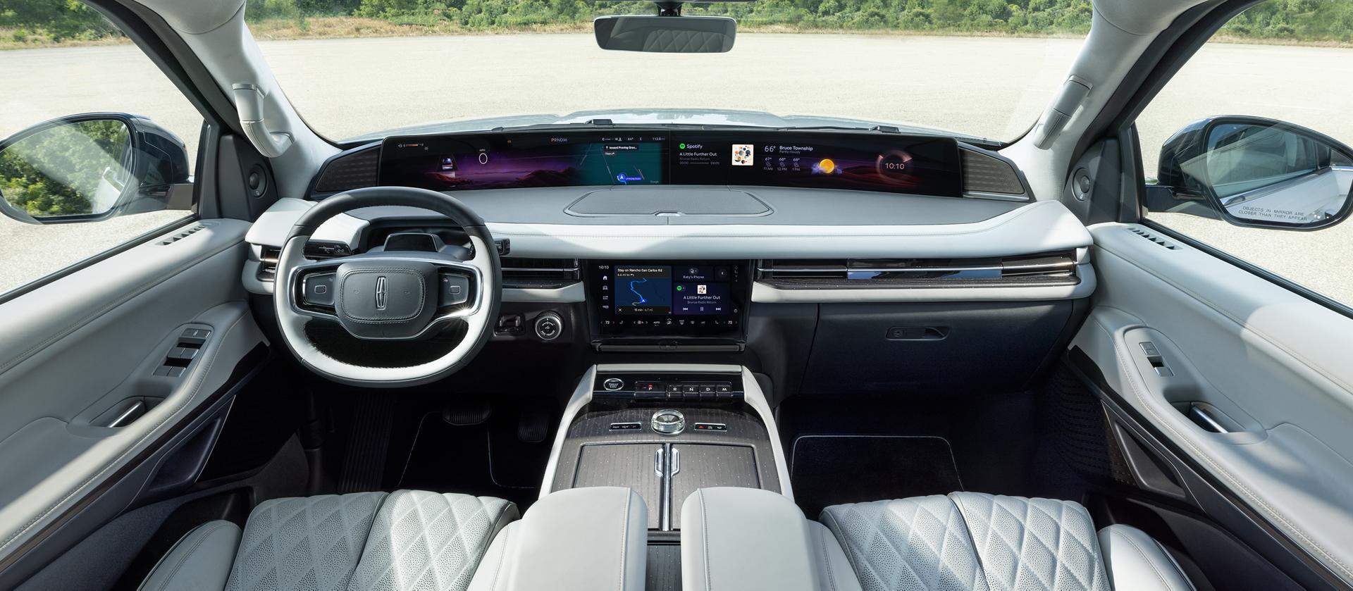 The panoramic display spans the width of a 2026 Lincoln Black Label Navigator® SUV with the Atmospheric interior theme