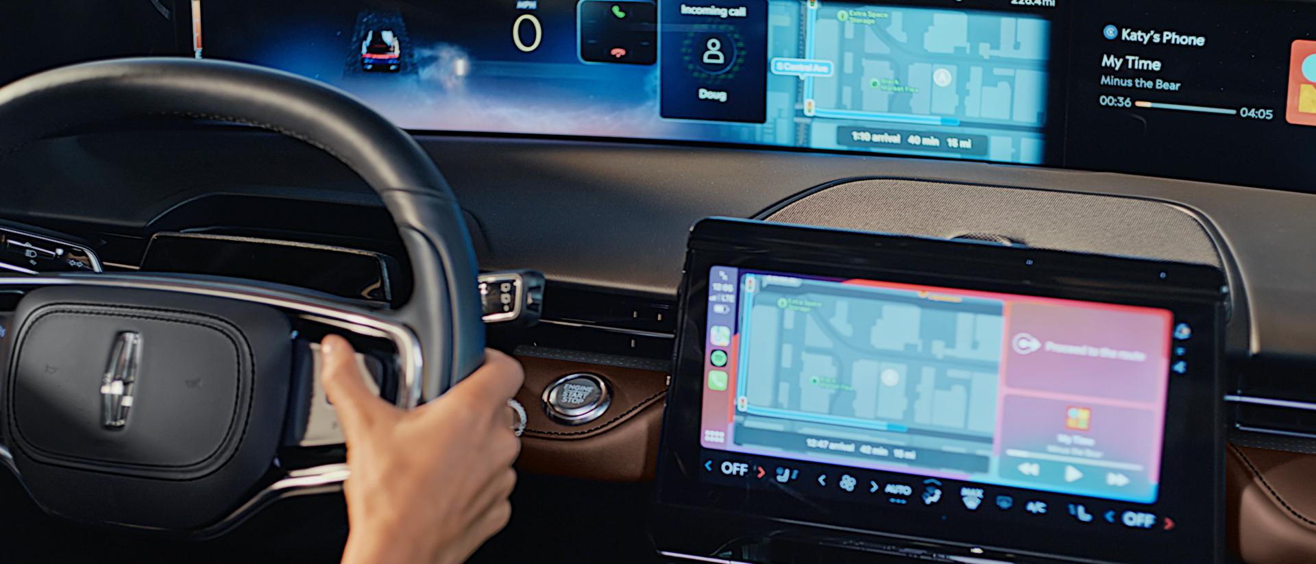The driver of a 2026 Lincoln Nautilus® SUV uses the Advanced steering wheel controls