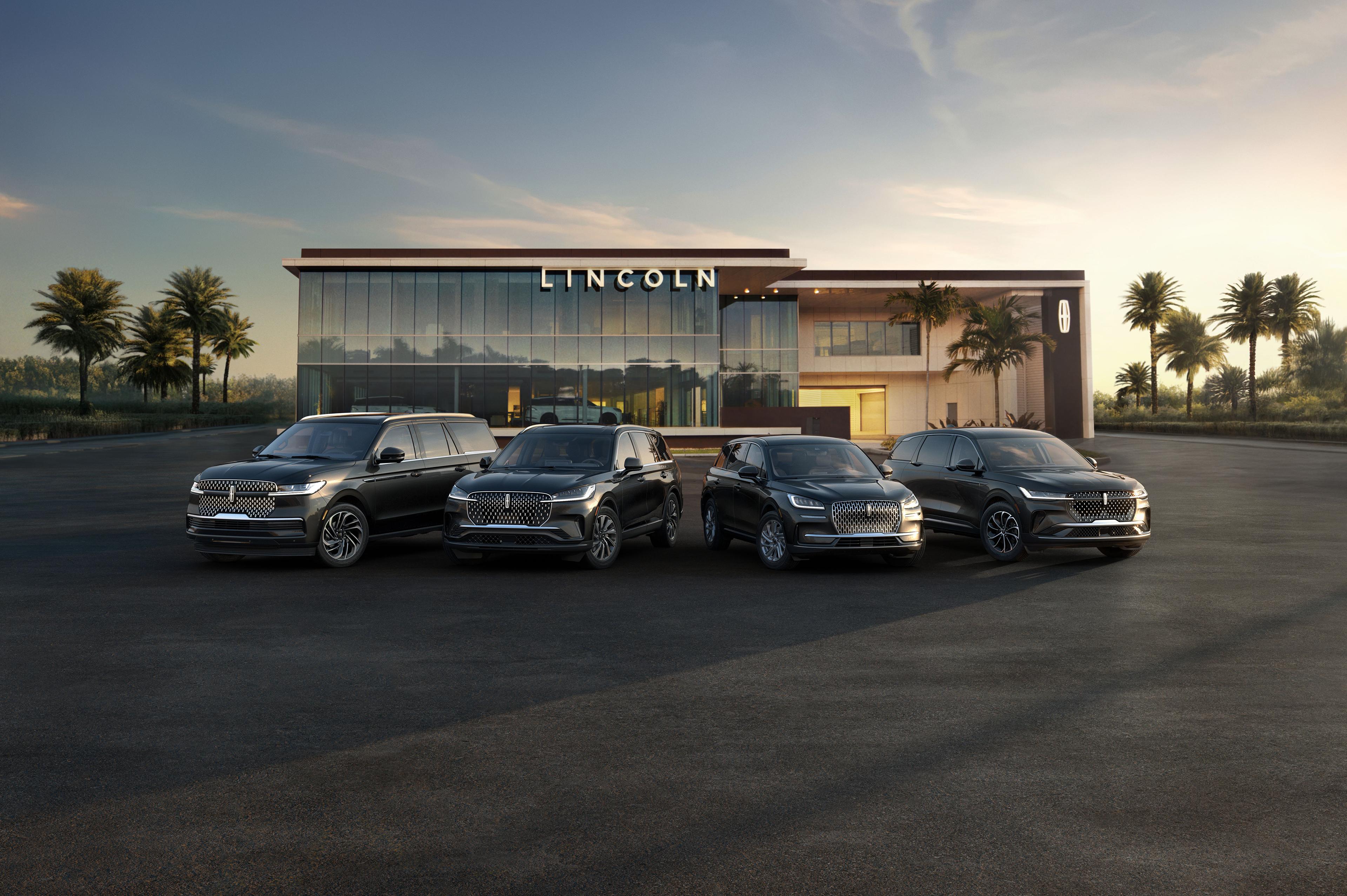 The Lincoln SUVs parked infront of a Lincoln dealership.