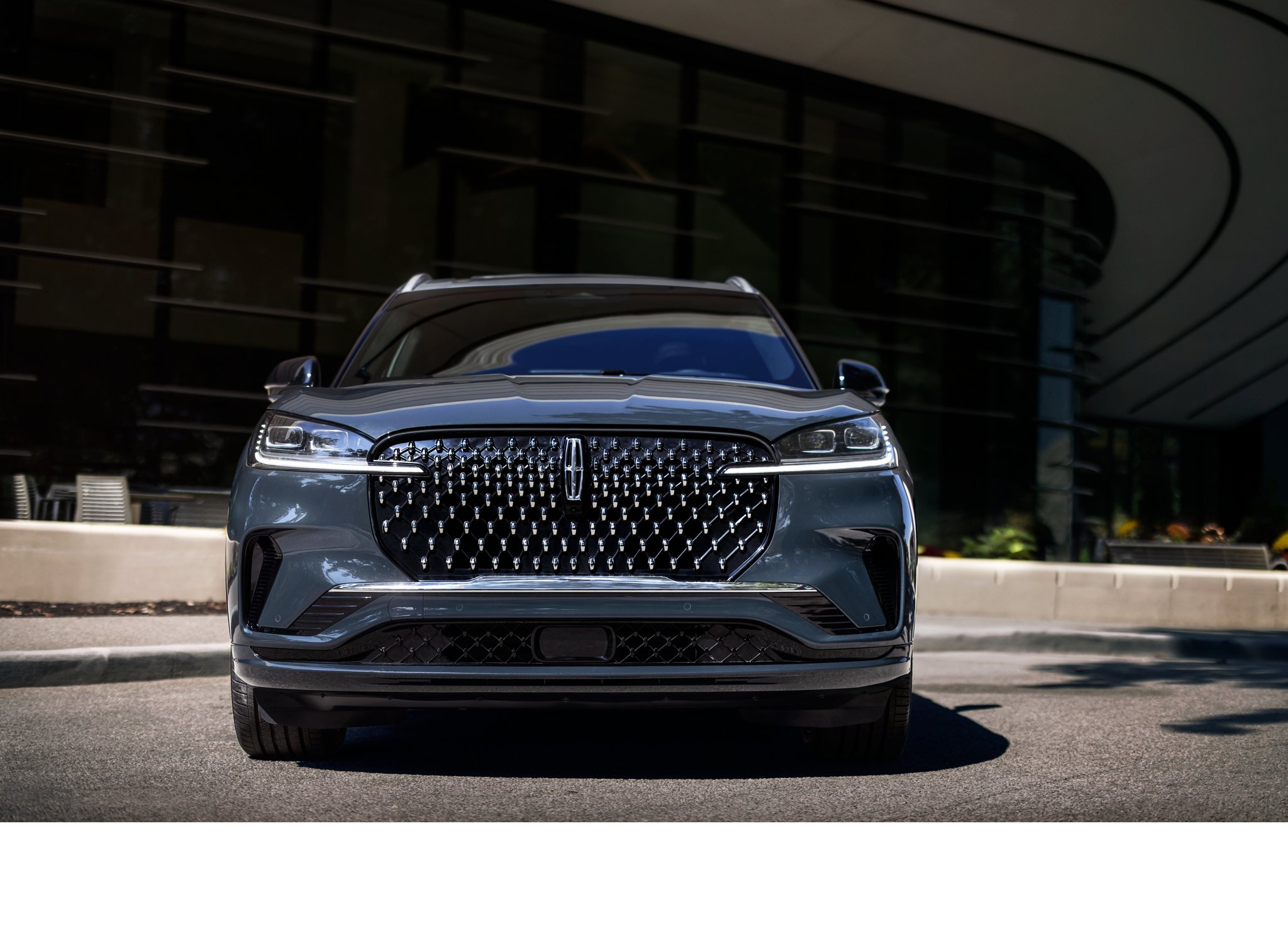 The 2025 Lincoln Aviator parked outside a building.