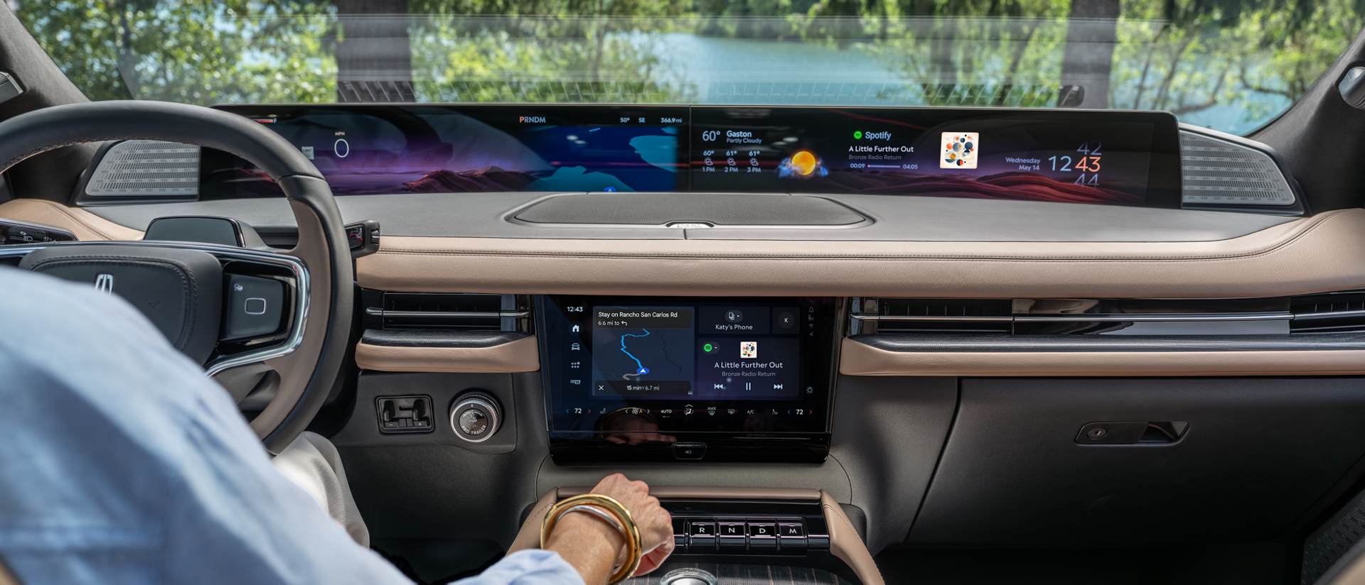An interior shot of the 2027 Lincoln Navigator® SUV shows the Waterfall Rejuvenate experience playing on both displays