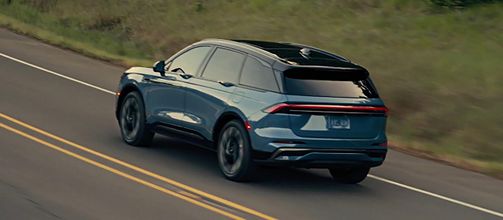 A 2026 Lincoln Nautilus® SUV is being driven on a rural road