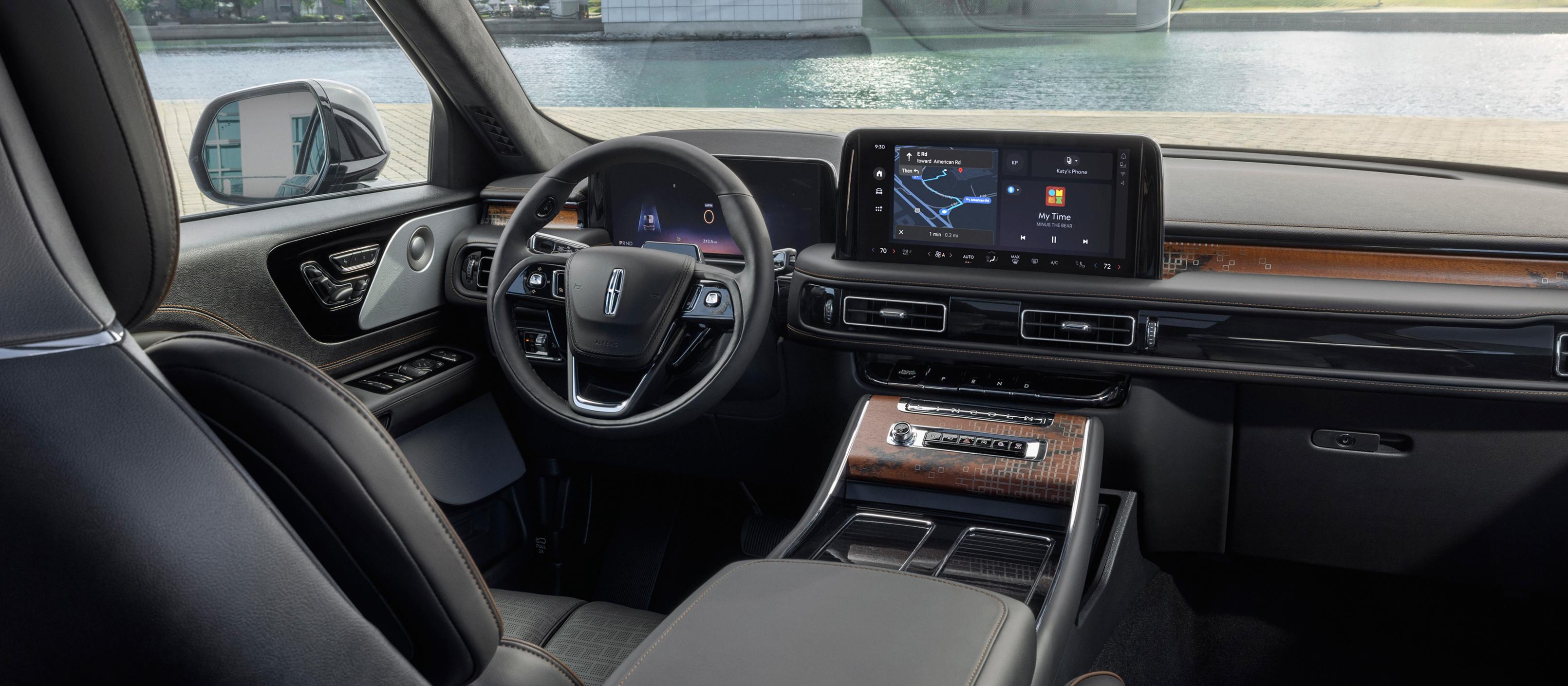 The front cabin of a 2025 Lincoln Black Label Nautilus® SUV is shown in the Invitation interior theme