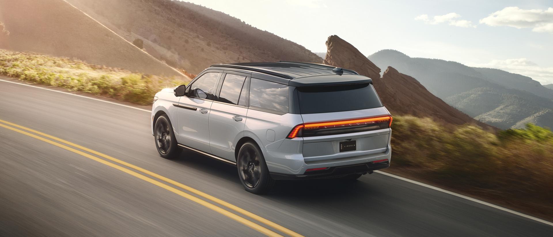 The available 2027 Lincoln Black Label™ Special Edition model being driven on a scenic mountain highway