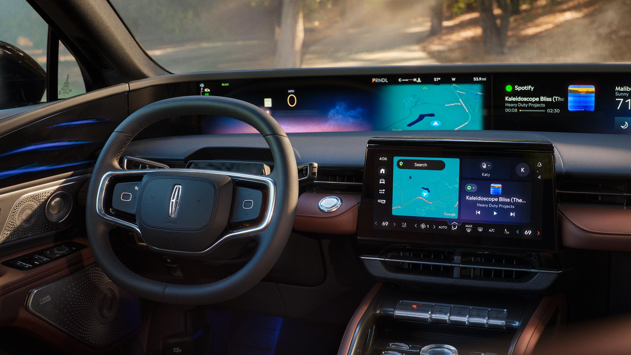 Lincoln steering wheel and center touchscreen displaying Spotify and navigation map with ambient blue interior lighting.