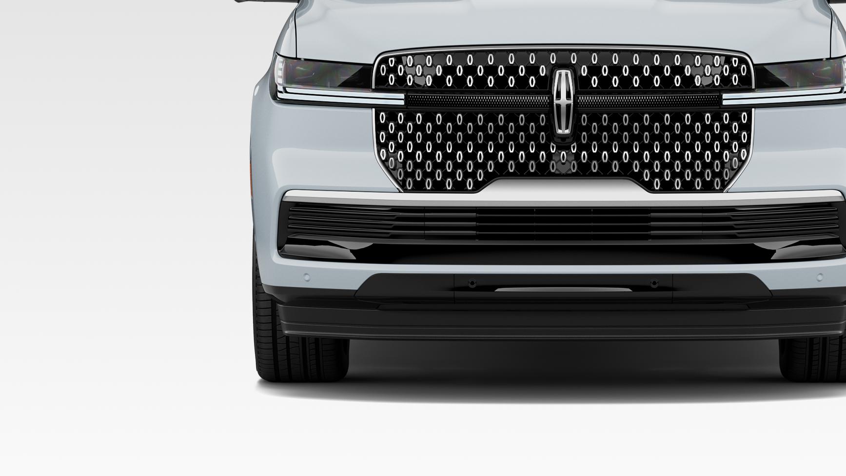 The front exterior of a 2027 Lincoln Navigator® SUV plays host to a body-colored bumper