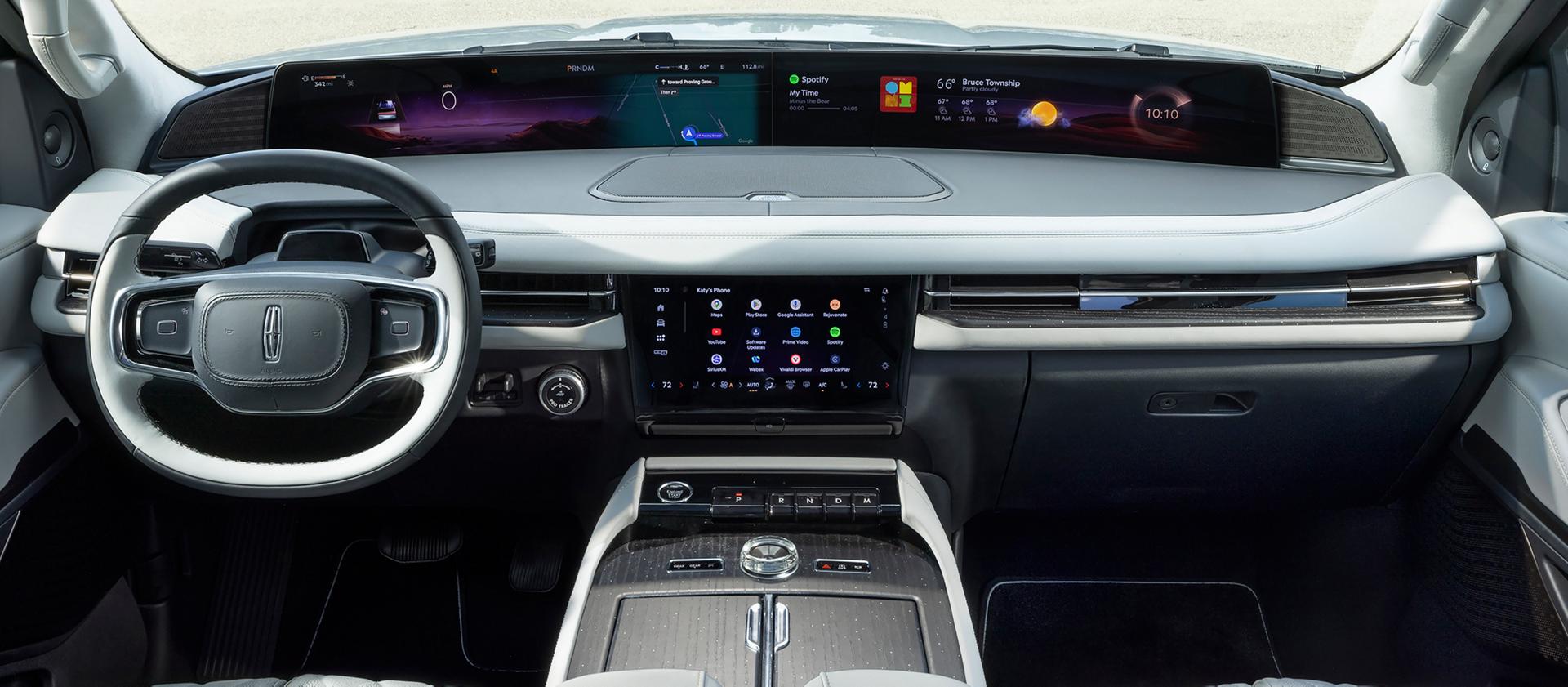 The panoramic display spans the width of a 2026 Lincoln Black Label Navigator® SUV with the Atmospheric interior theme