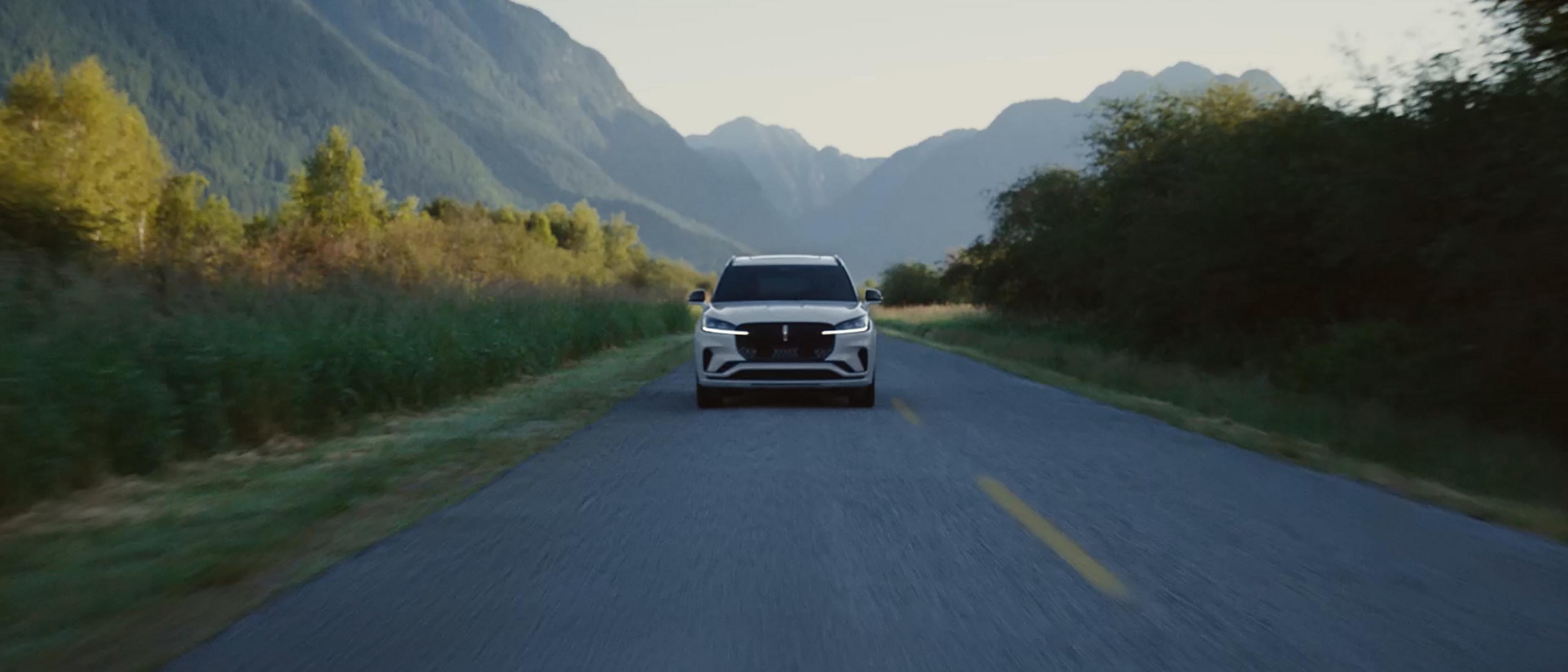 A 2027 Lincoln Aviator® is being driven on a country road