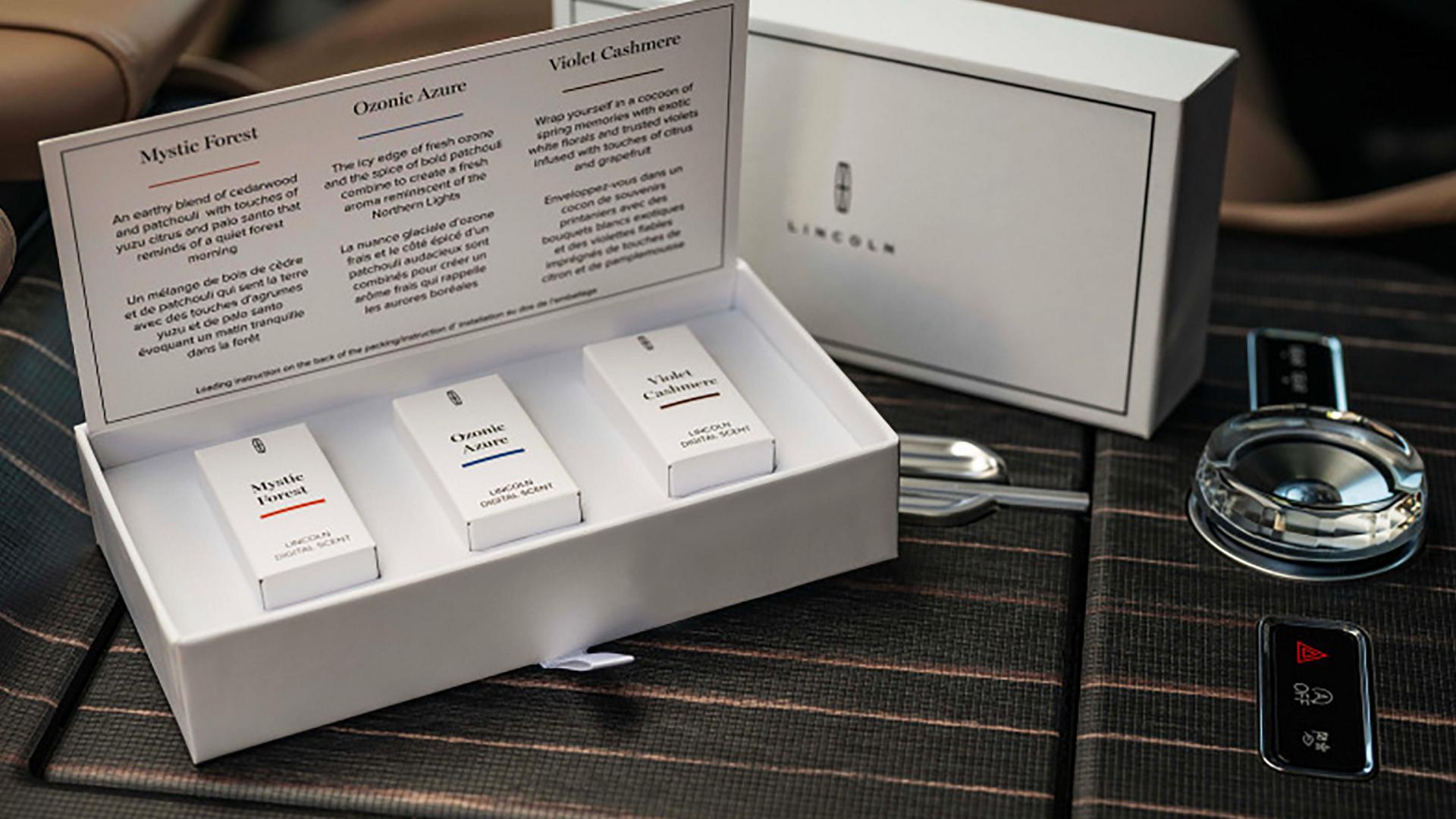 Lincoln Digital Scent cartridges rest on the center console of a 2027 Lincoln Navigator® SUV