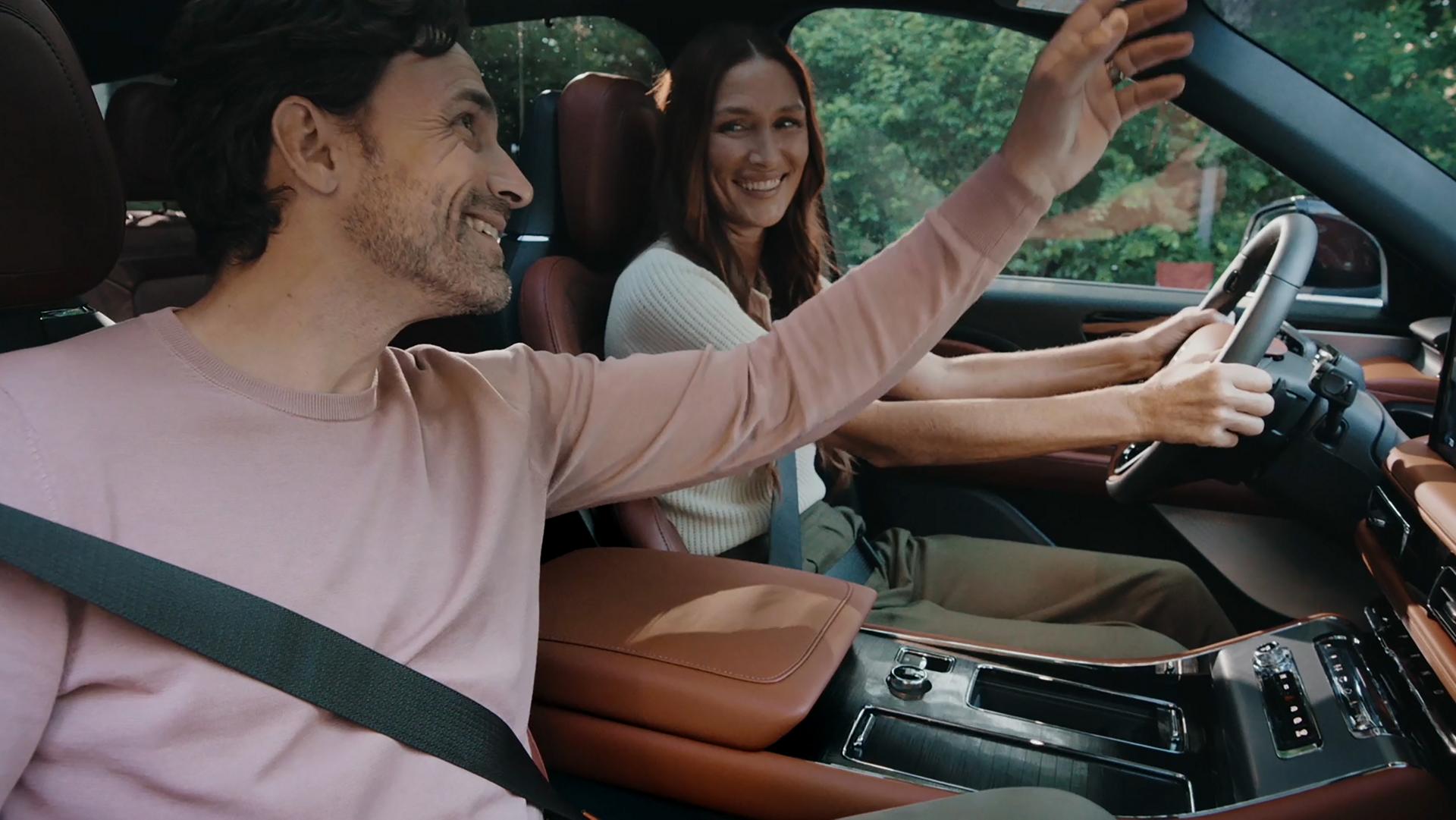 A couple sits in the front seats of a 2026 Lincoln Aviator® SUV