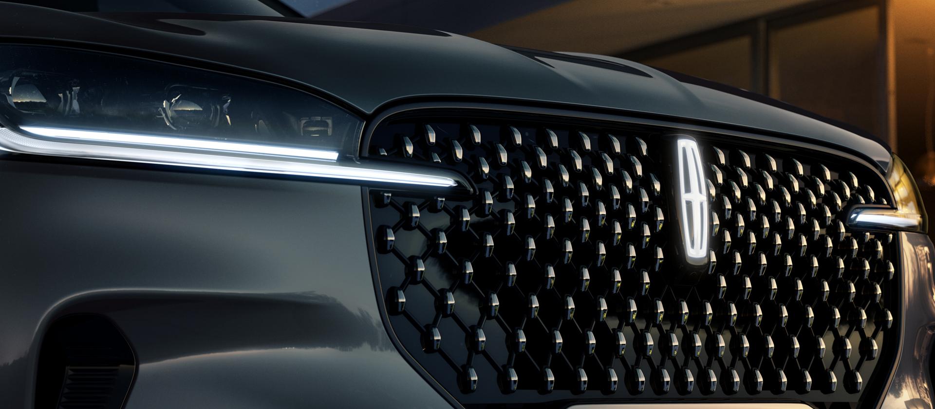 A Lincoln Star logo glows in the center of the grille on a 2027 Lincoln Aviator® Black Label™ SUV