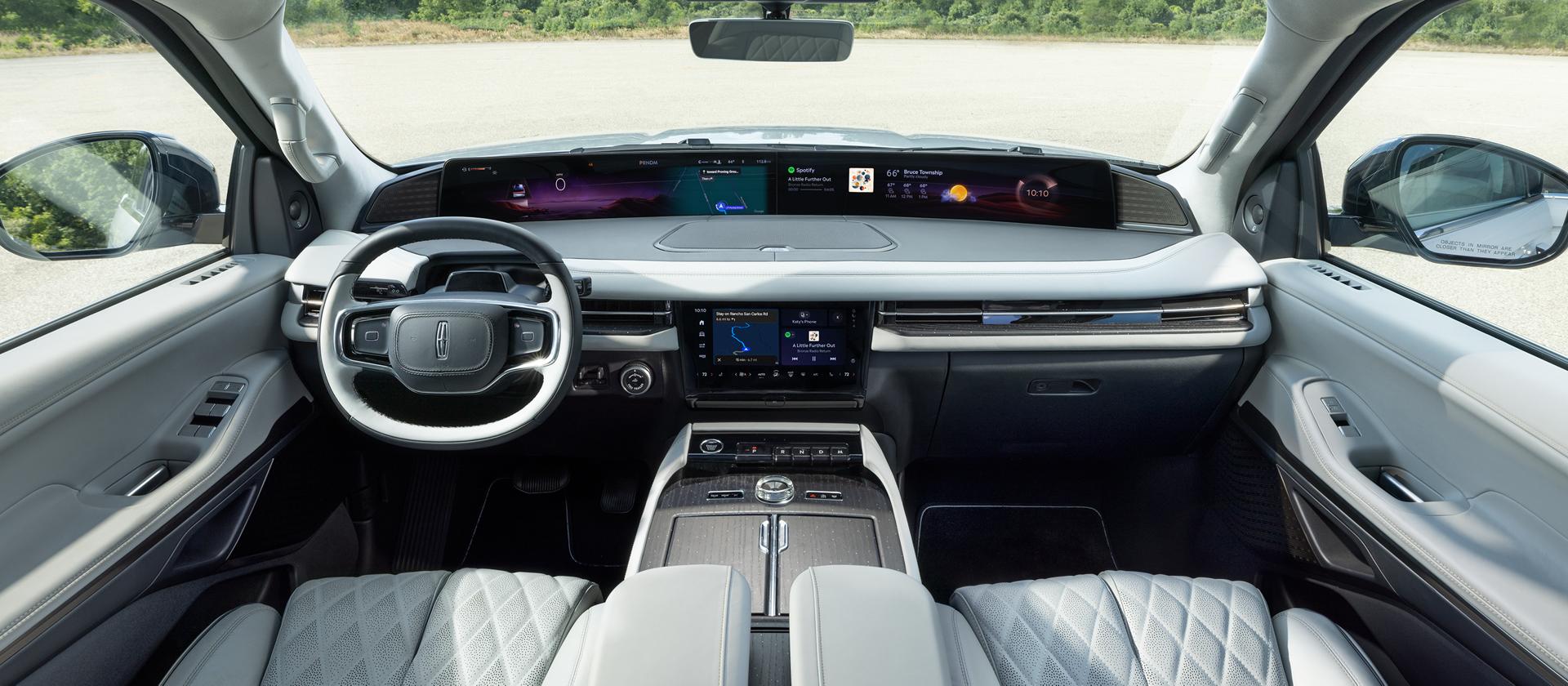 The panoramic display spans the width of a 2027 Lincoln Navigator Black Label™ SUV with the Atmospheric interior theme
