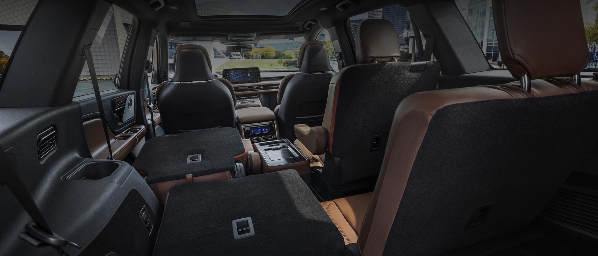 The driver's side second and third rows of 2027 Lincoln Aviator® SUV are folded flat