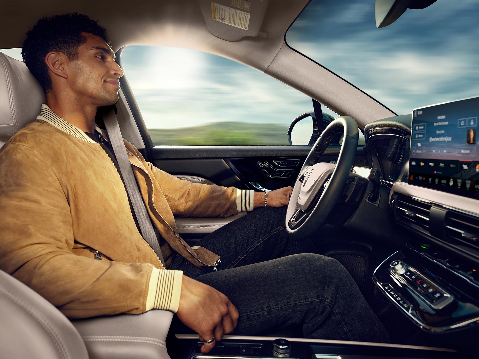 A man sitting in the driver seat of a 2025 Lincoln Corsair.