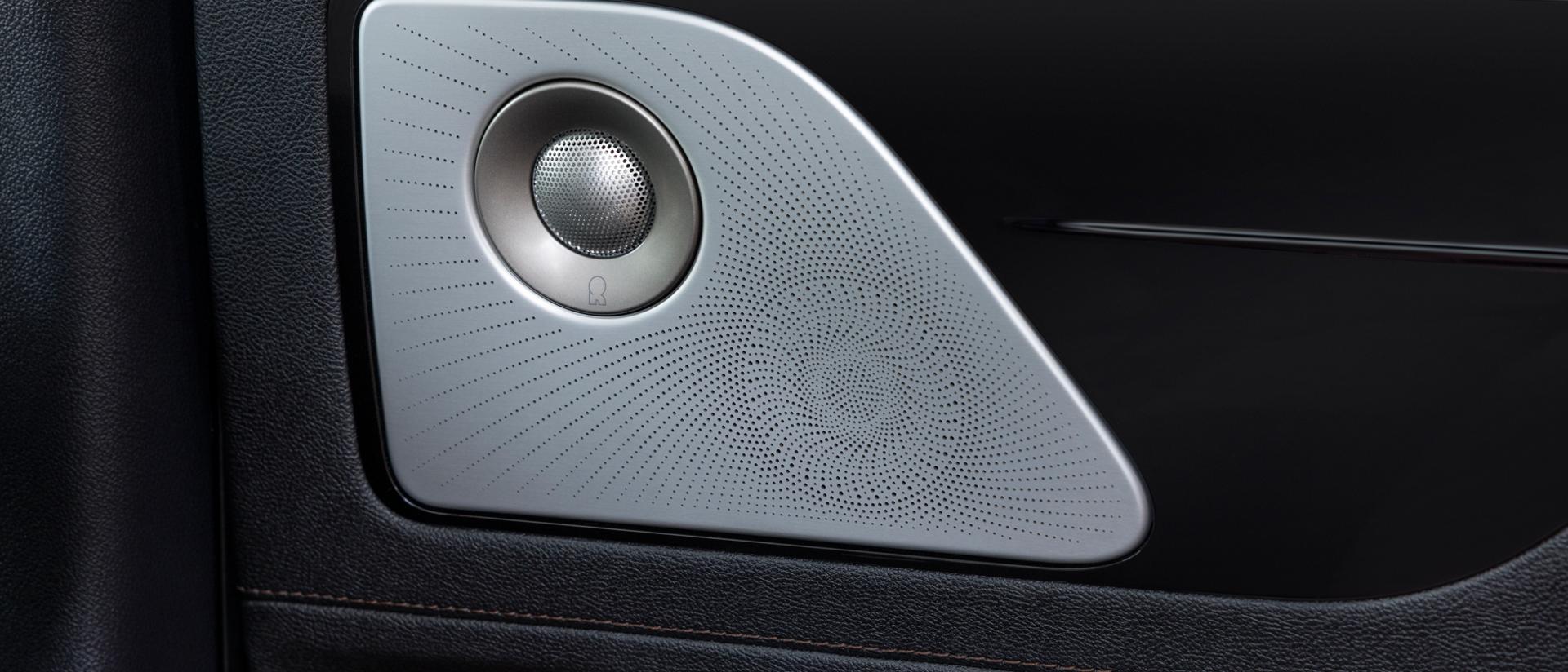 A Revel® speaker is shown on the interior door pane of a 2026 Lincoln Aviator® SUV