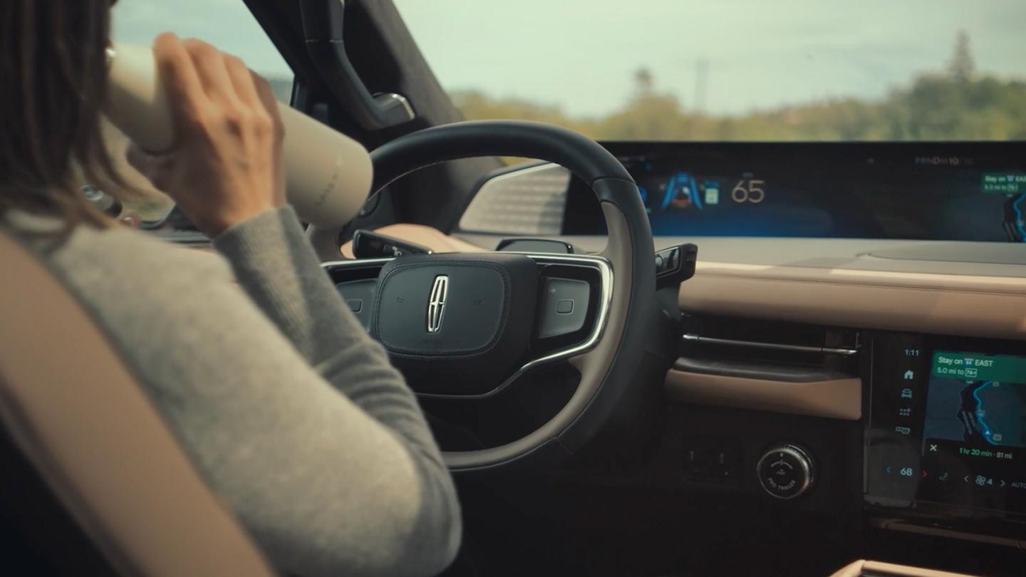 A 2027 Lincoln Navigator® SUV being driven on a country road