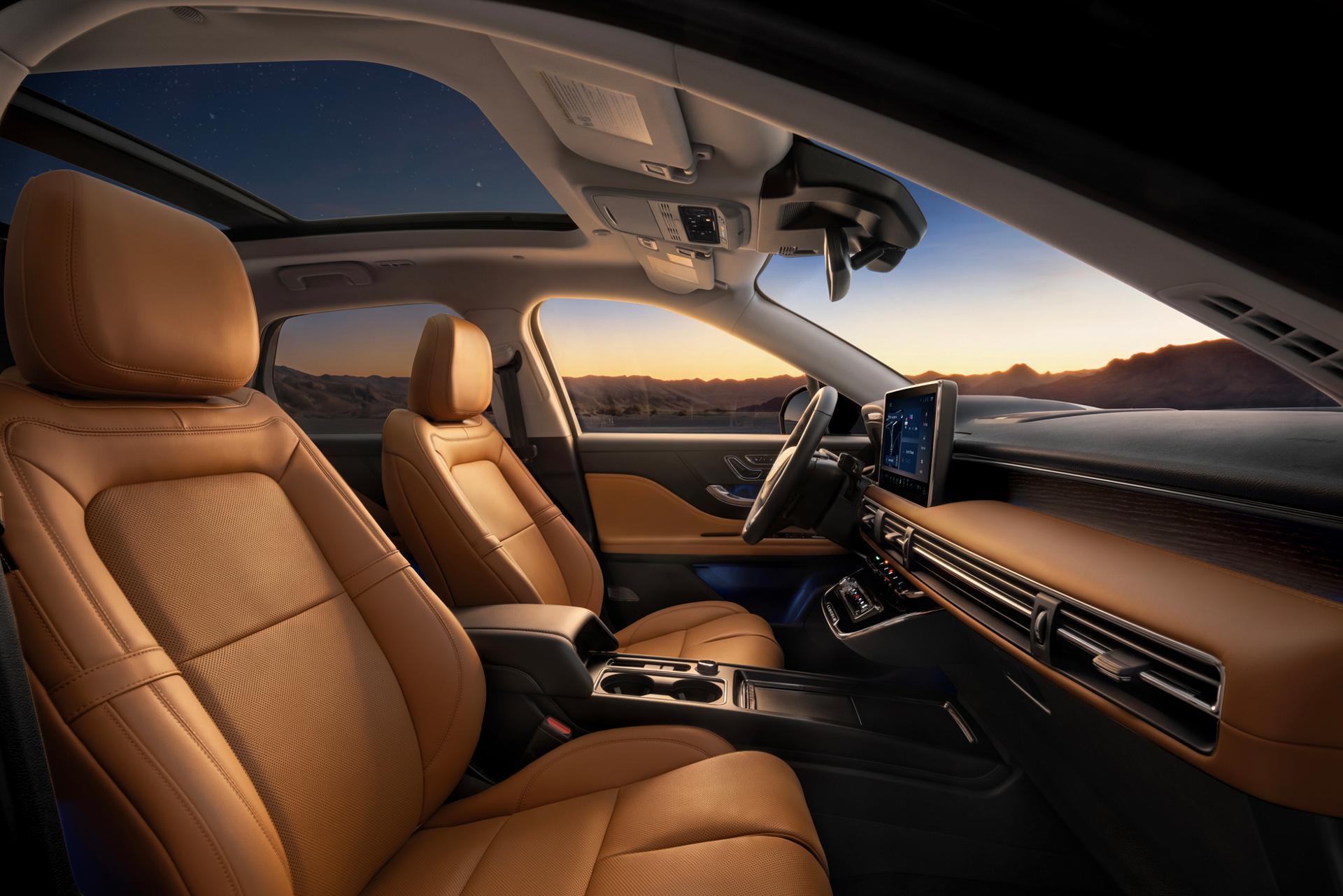 The interior of a 2027 Lincoln Corsair® Hybrid featuring Perfect Position front seats