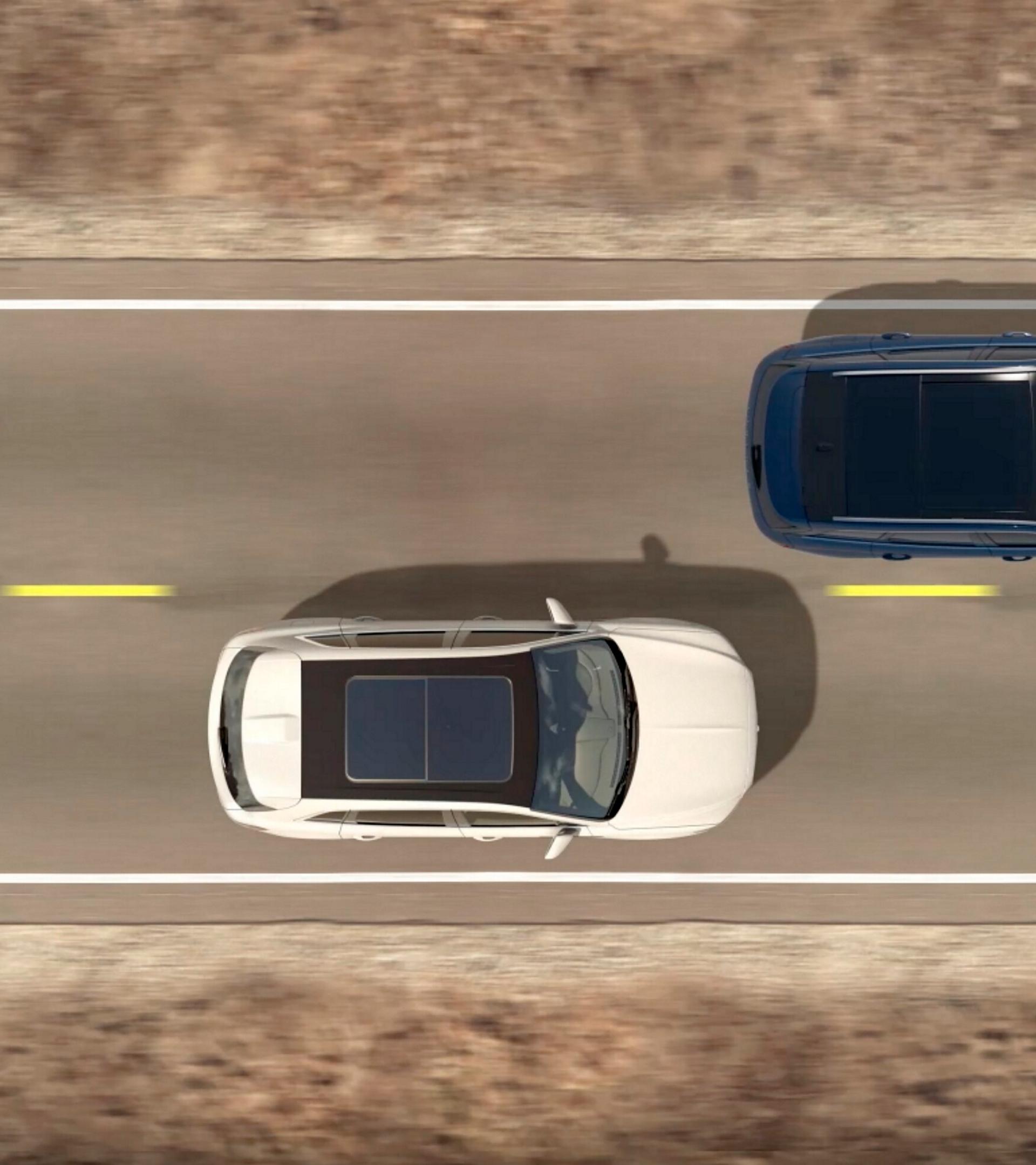 An overhead illustration of two cars being driven indicates how blind spot detection.