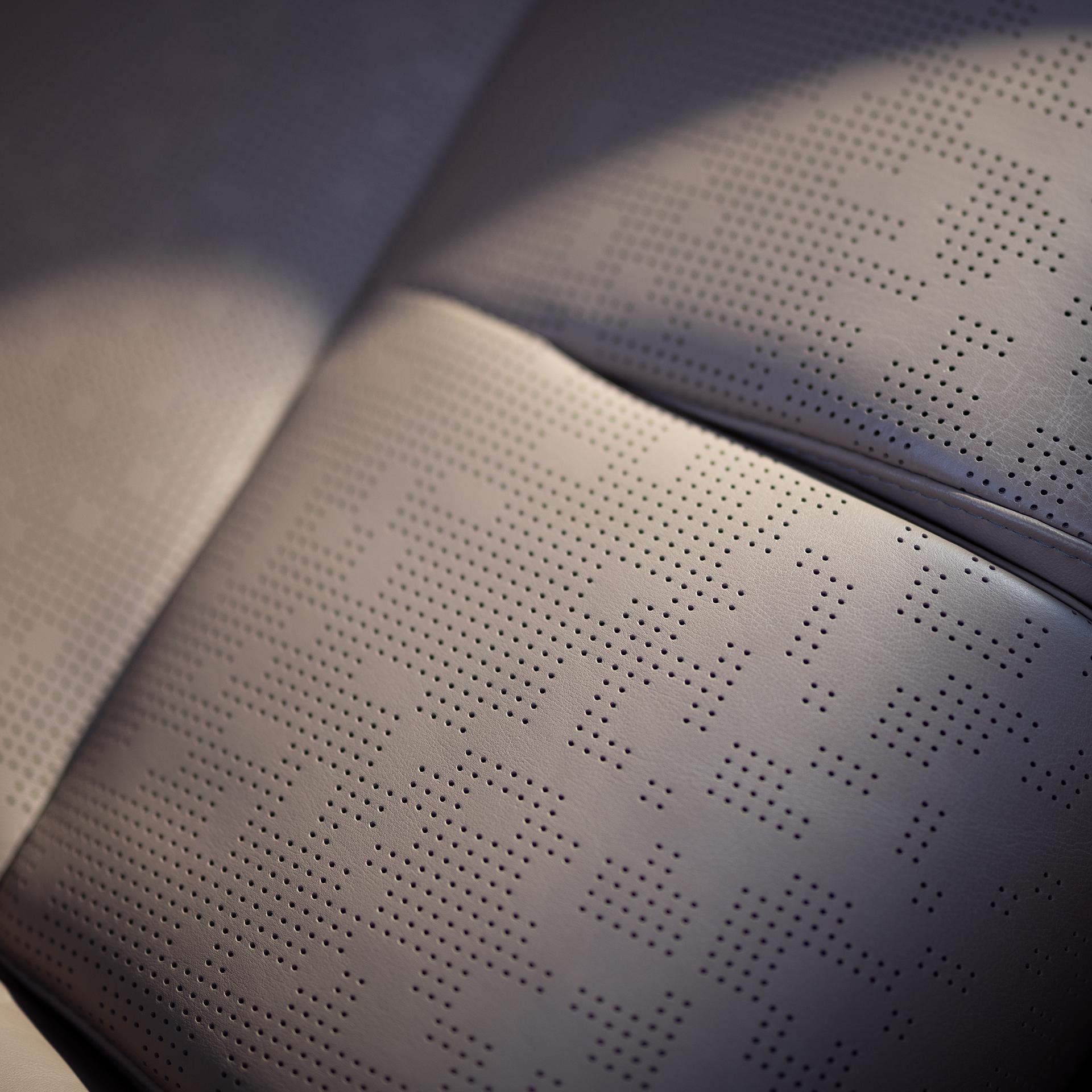 A close up of the perforated patterned seat of a 2027 Lincoln Navigator® Black Label™ with the Enlighten theme