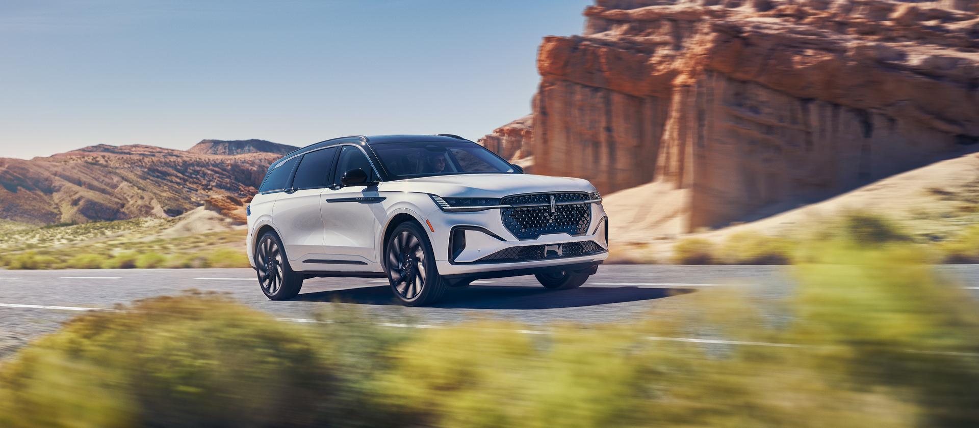 A 2026 Lincoln Nautilus® SUV is being driven on a desert highway