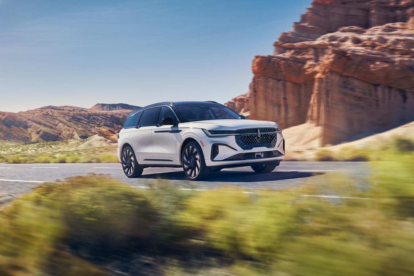 A 2026 Lincoln Nautilus® SUV is being driven on a highway in the desert