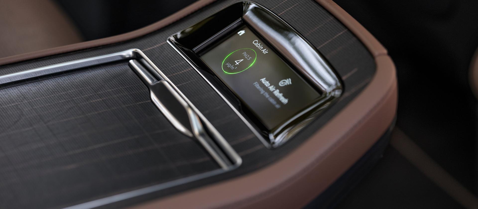 The Horizon Grid real-wood appliqué on the second row controls in the 2026 Lincoln Navigator® Black Label™ SUV