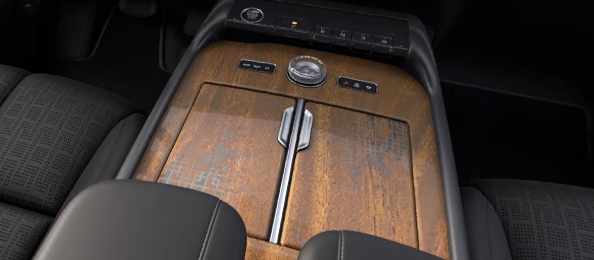 Khaya real-wood appliqué of the Invitation theme on the center console of a 2027 Navigator® Lincoln Black Label™ SUV