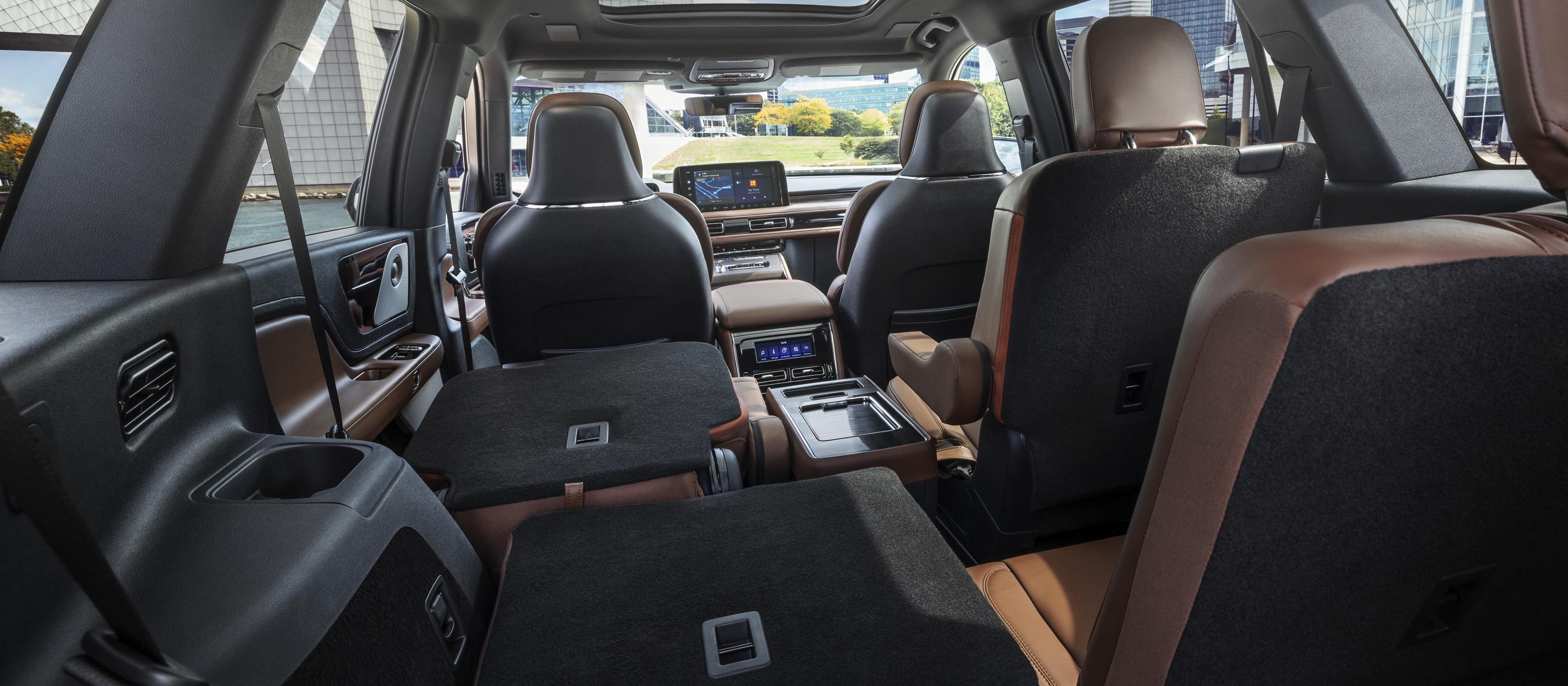 The interior of a 2026 Lincoln Aviator® SUV shown from the third row looking forward
