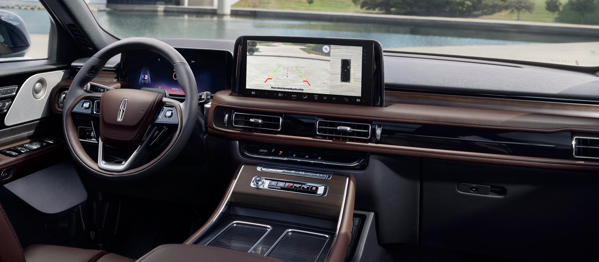 A rear view of what is behind a 2026 Lincoln Aviator® SUV is shown in the center touchscreen