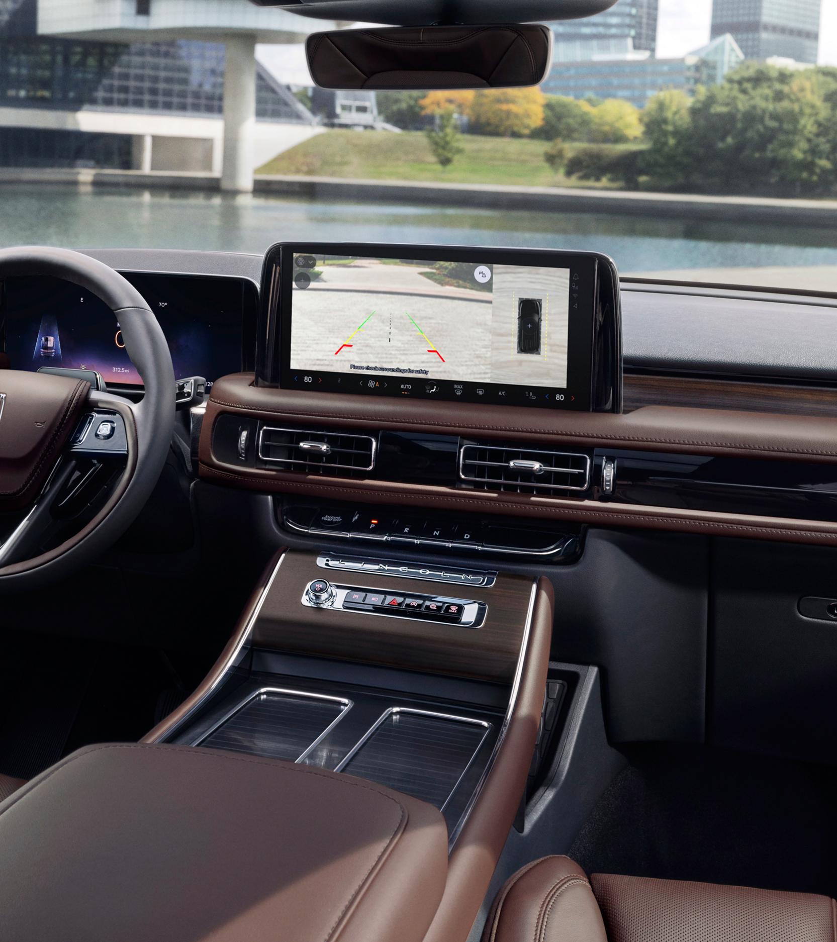 A rear view of what is behind a 2026 Lincoln Aviator® SUV is shown in the center touchscreen