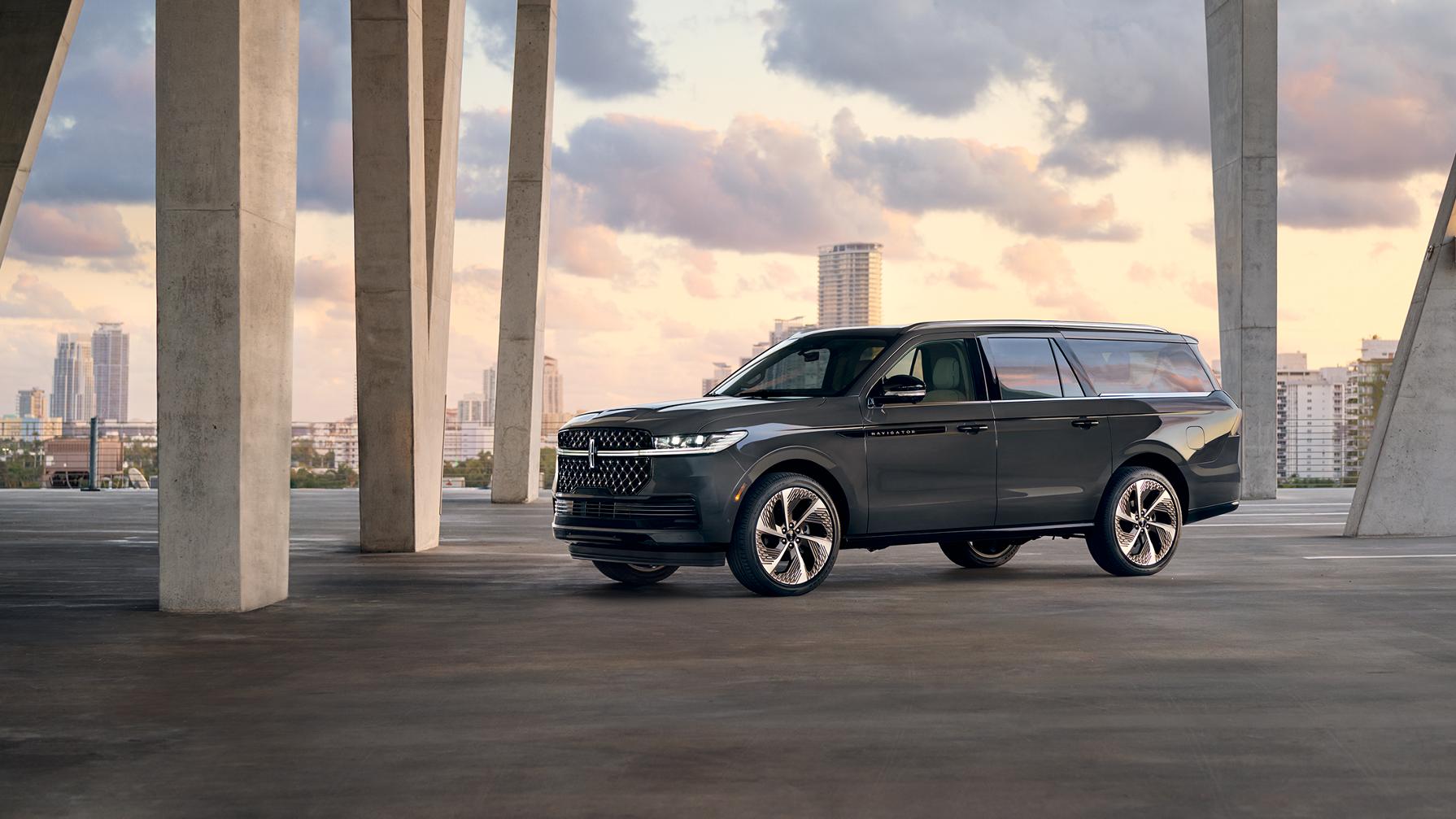 The 2026 Lincoln Navigator parked in a parking garage with a cityscape in the background.