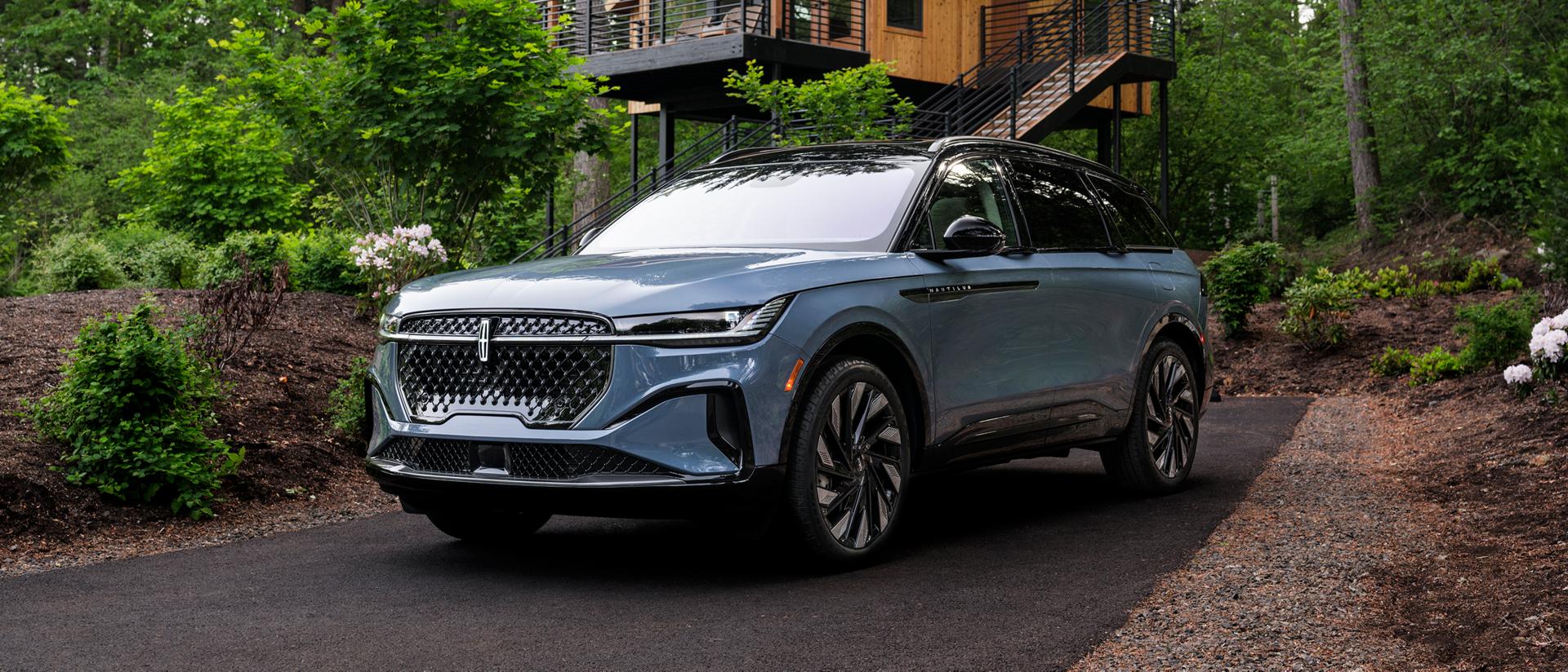 he front of a 2026 Lincoln Nautilus® SUV parked in front of a house