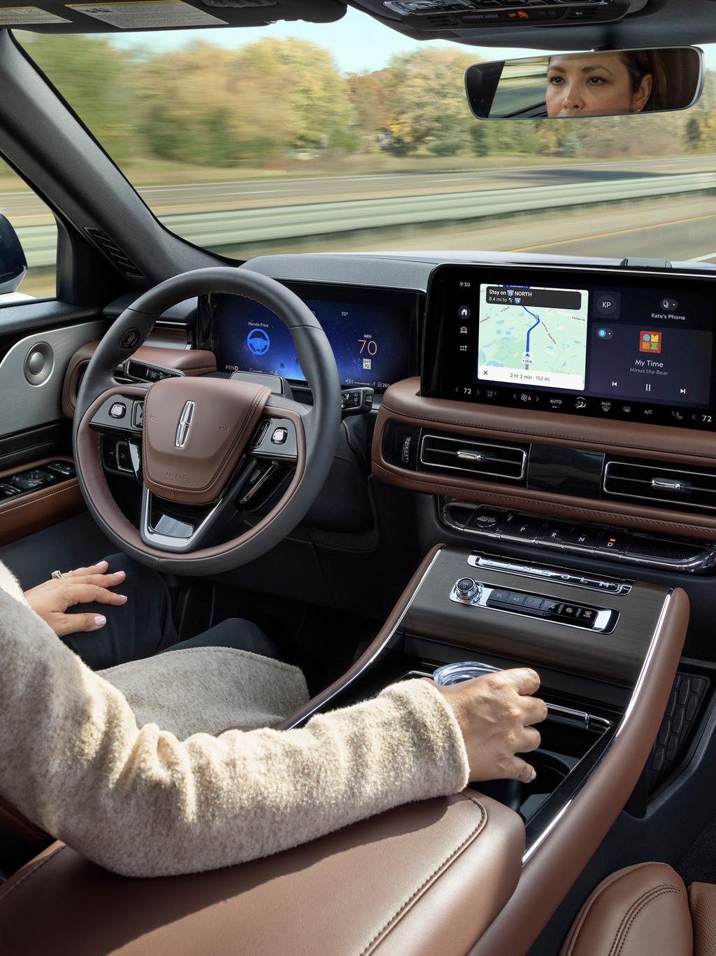 A woman in the driver's seat of a 2025 Lincoln Aviator® drives hands-free with her eyes on the road ahead