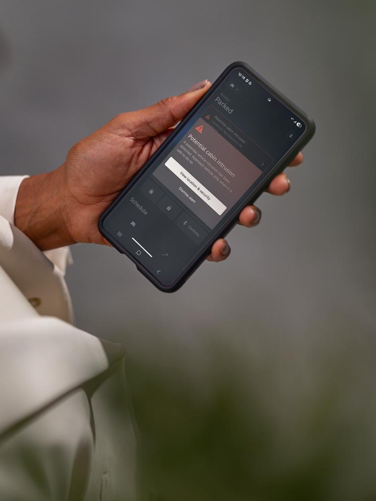 A woman holding her smartphone.