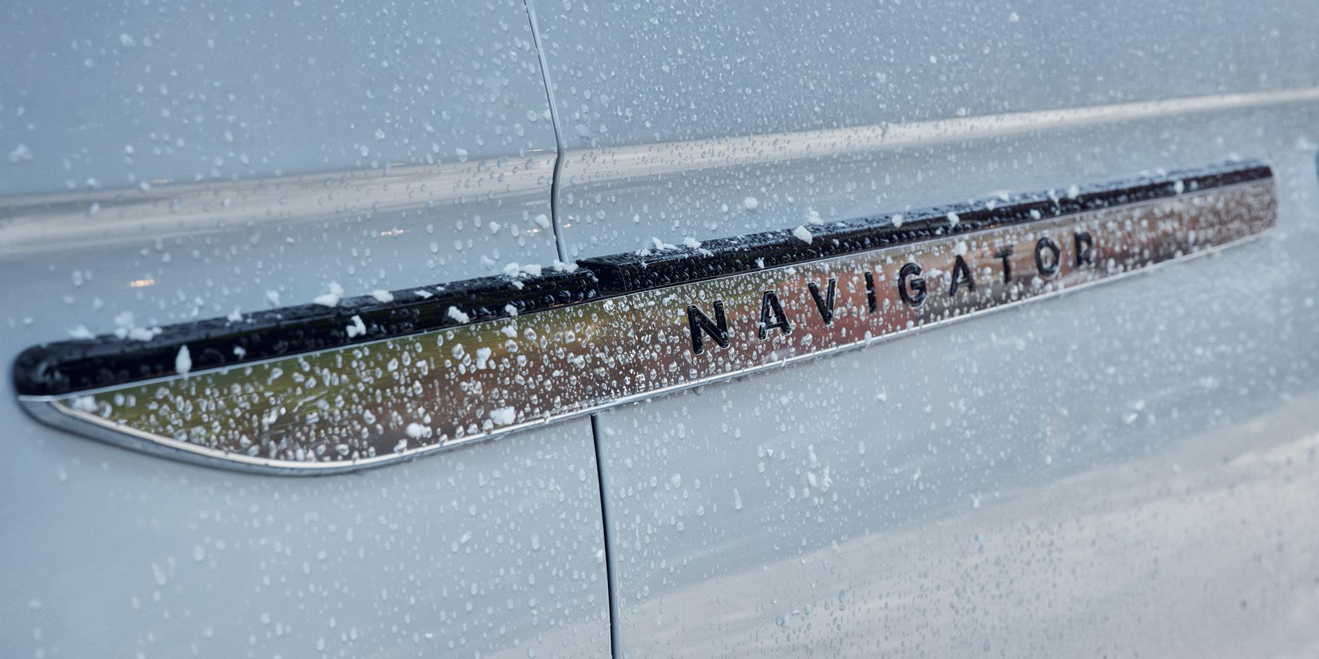 The Navigator name badge on the Driver's door of a 2027 Lincoln Navigator® SUV