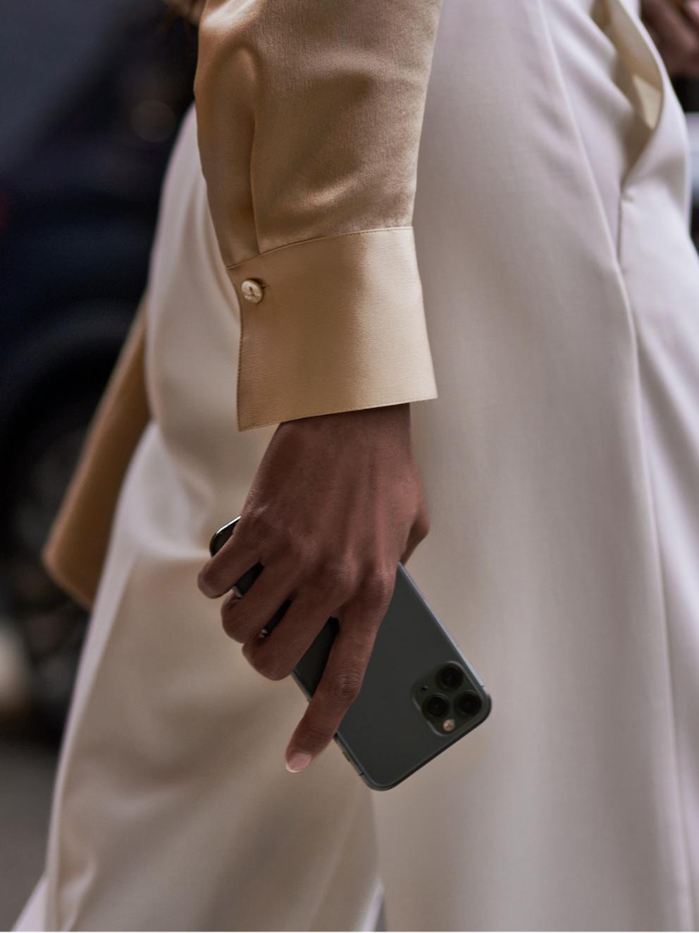 A woman holding a cellphone.