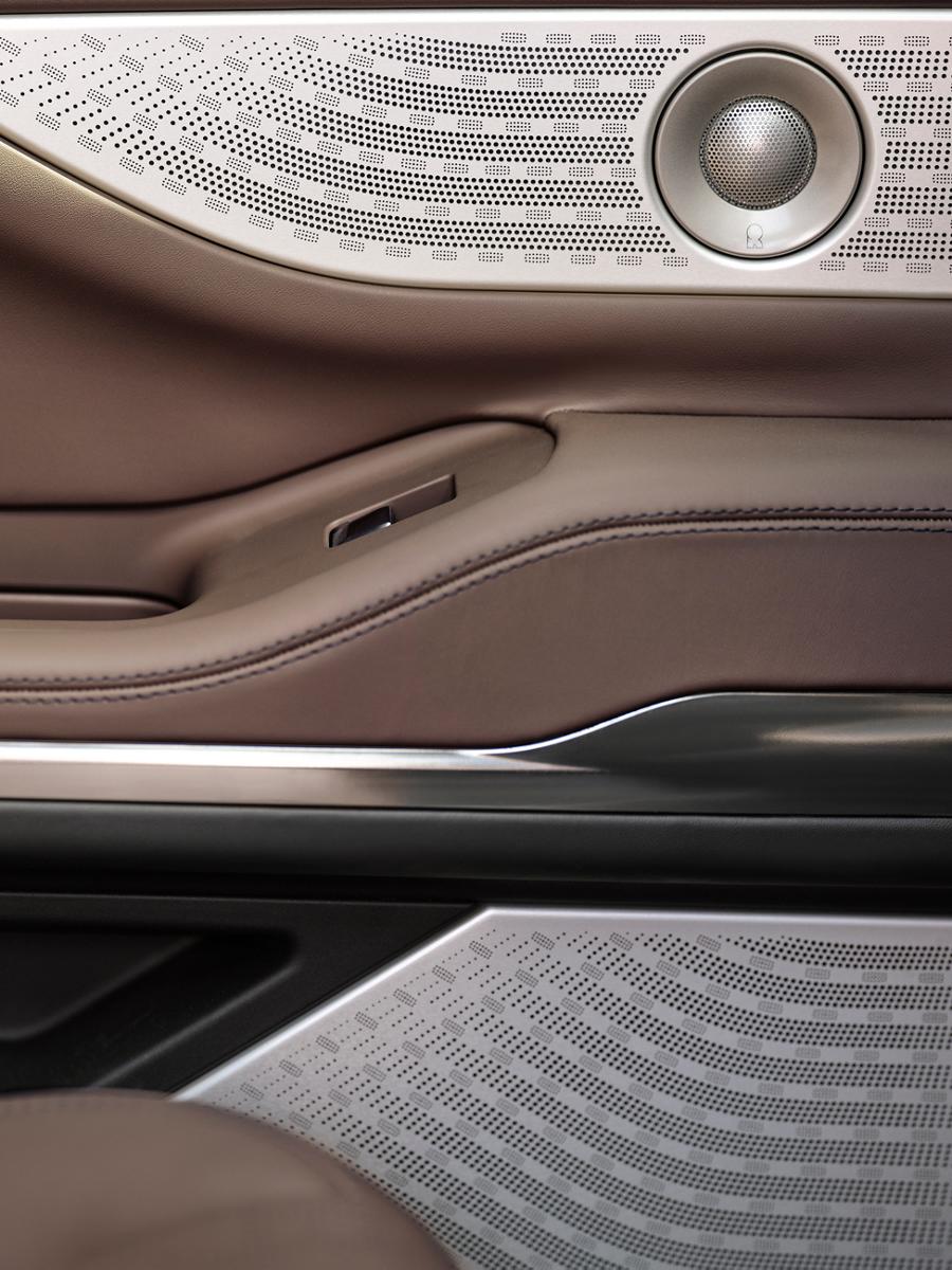 A close-up of the laser-cut pattern on the Revel® speaker inside a 2026 Lincoln Navigator® Black Label