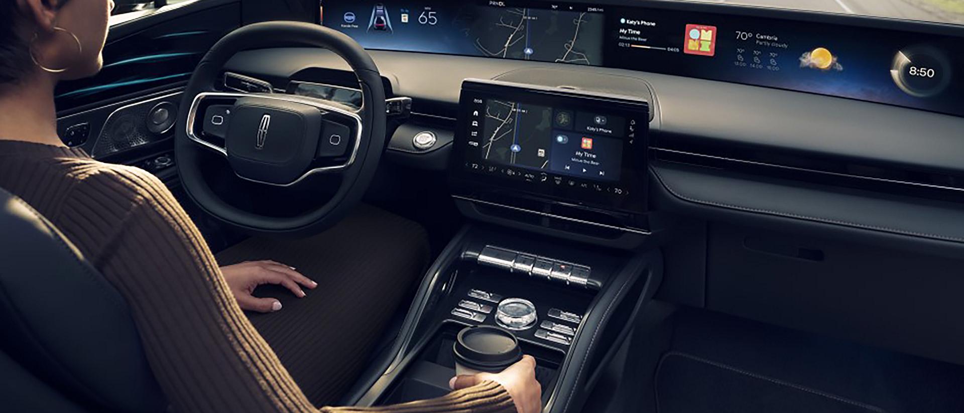 A driver of a Lincoln SUV enjoys hands-free highway driving courtesy of Lincoln BlueCruise