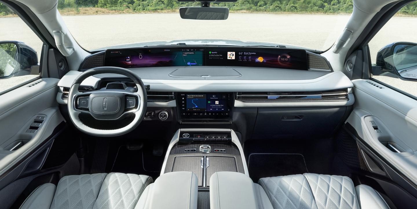 The front interior of a 2027 Lincoln Black Label Navigator in Atmospheric theme