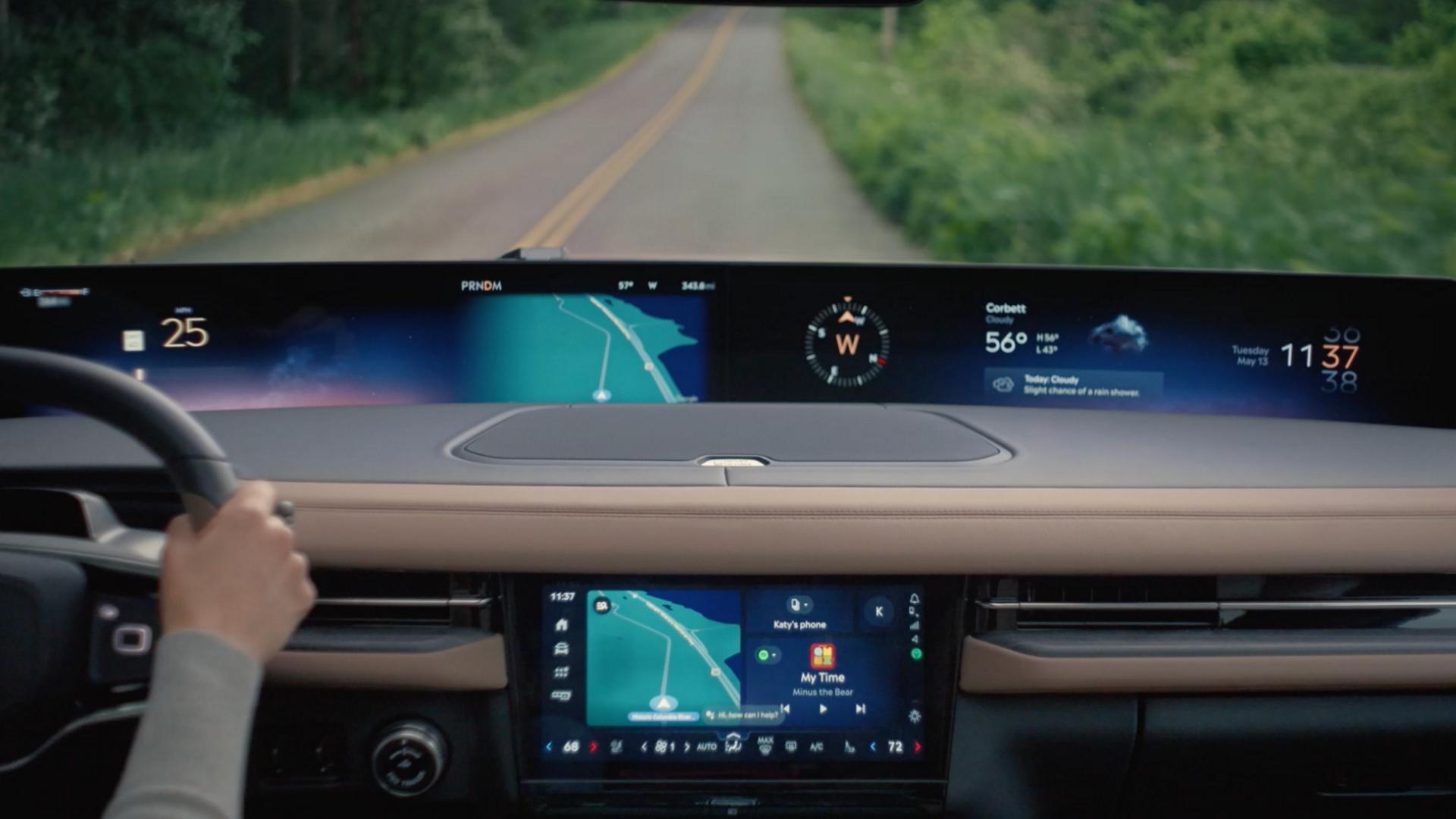 An interior view of a 2027 Lincoln Navigator® SUV being driven on a country road