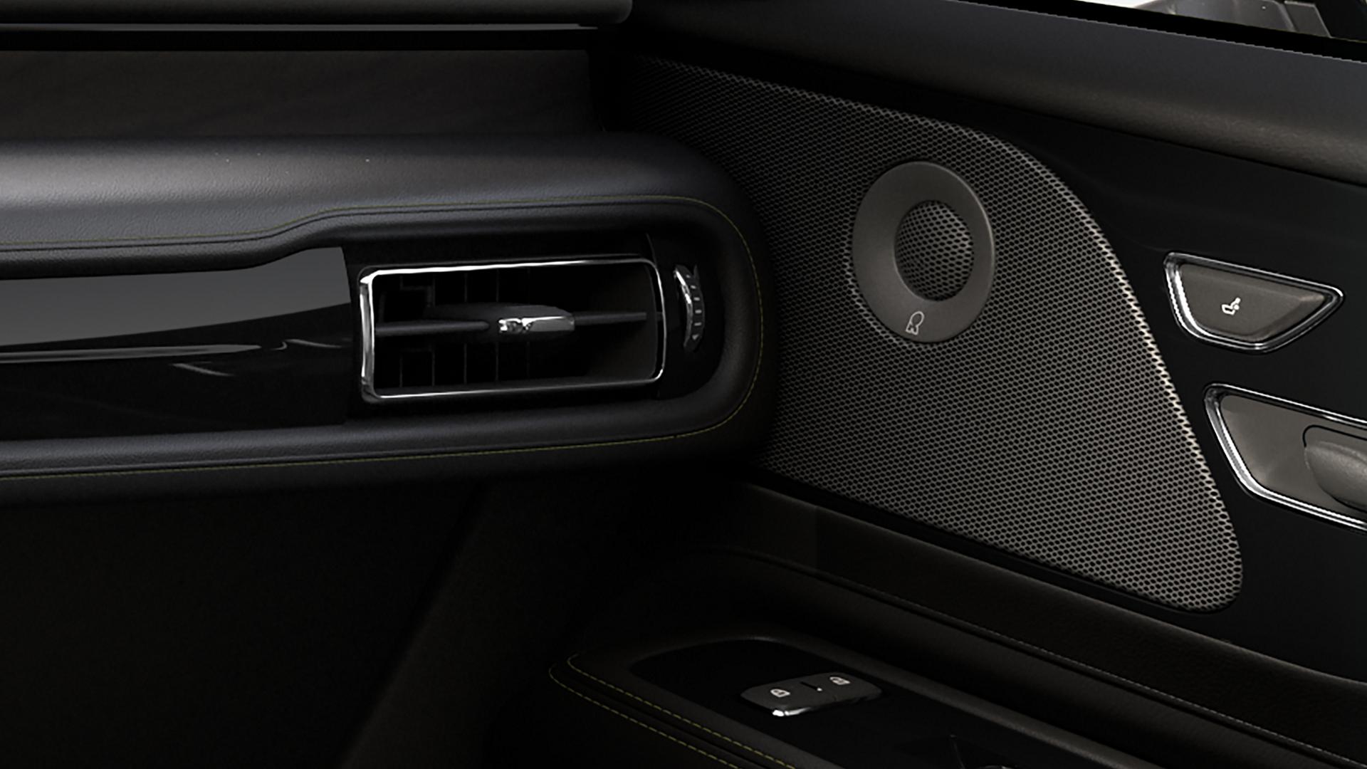 An audio system speaker built into the front passenger door of a 2027 Lincoln Aviator® SUV