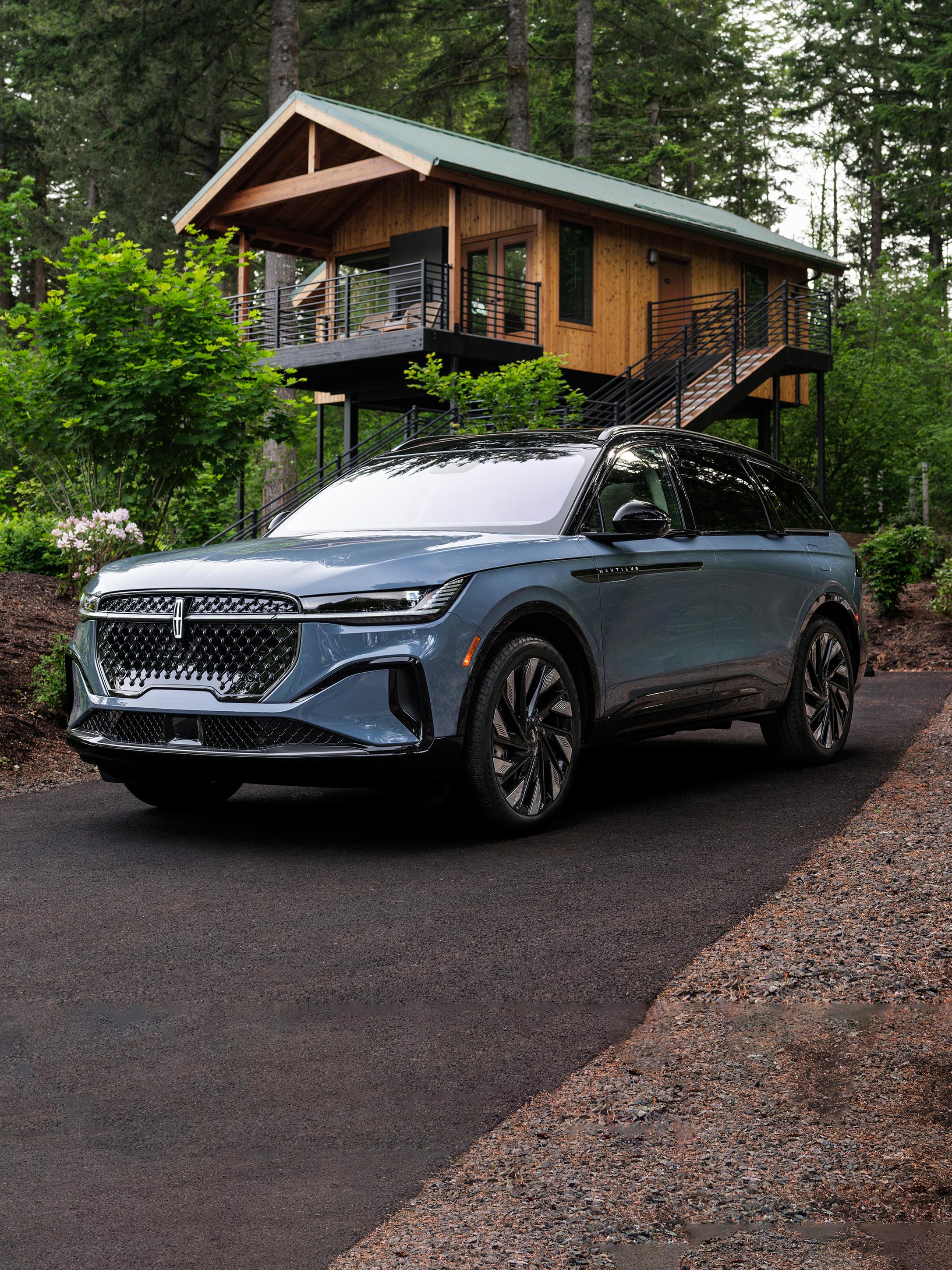 The front of a 2026 Lincoln Nautilus® SUV parked in front of a house