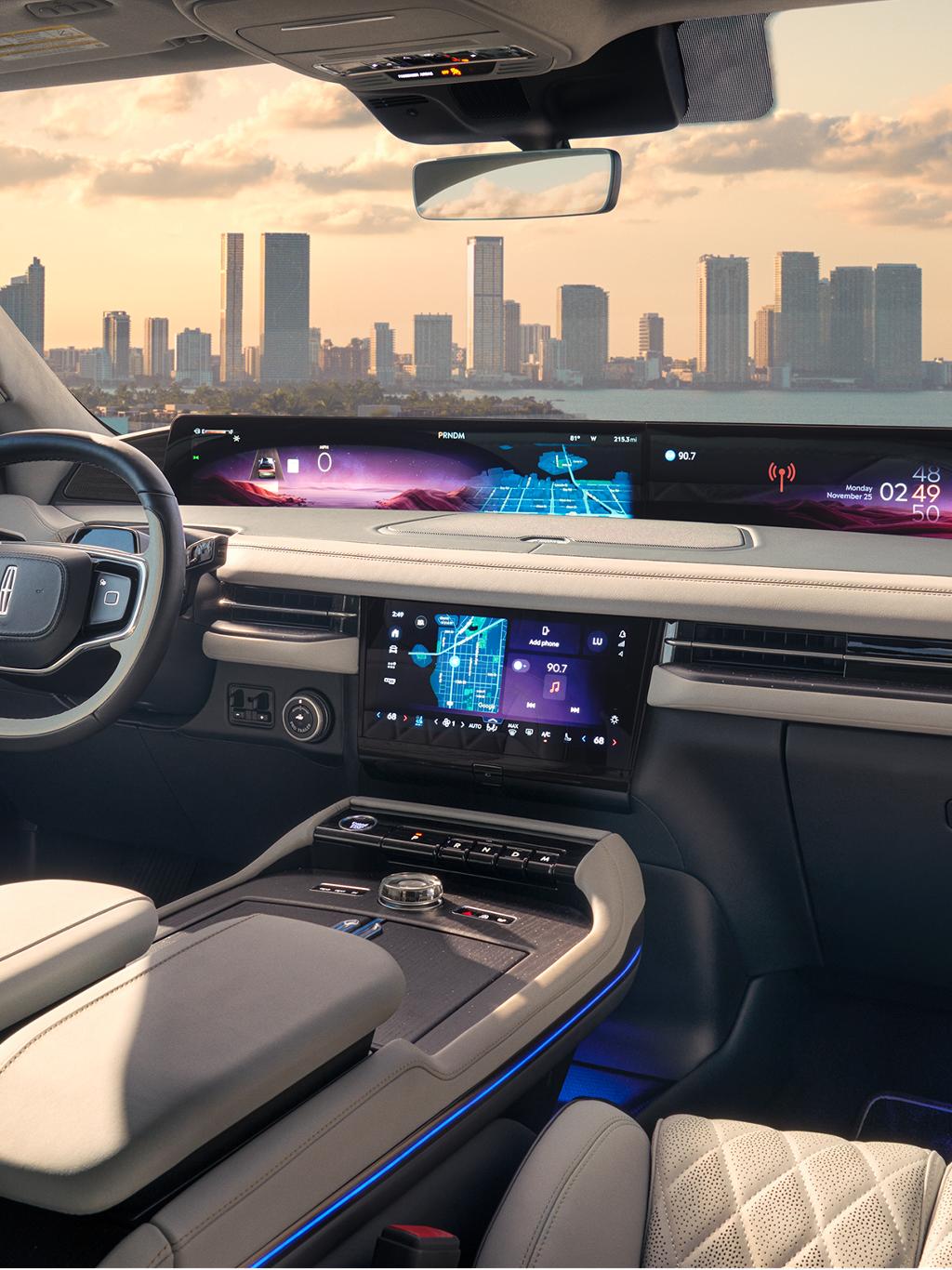 A man using the center touchscreen on his Lincoln Aviator.