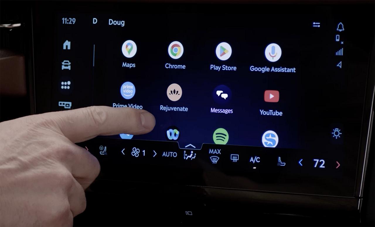 A person interacts with the center touchscreen of a 2027 Lincoln Navigator® SUV