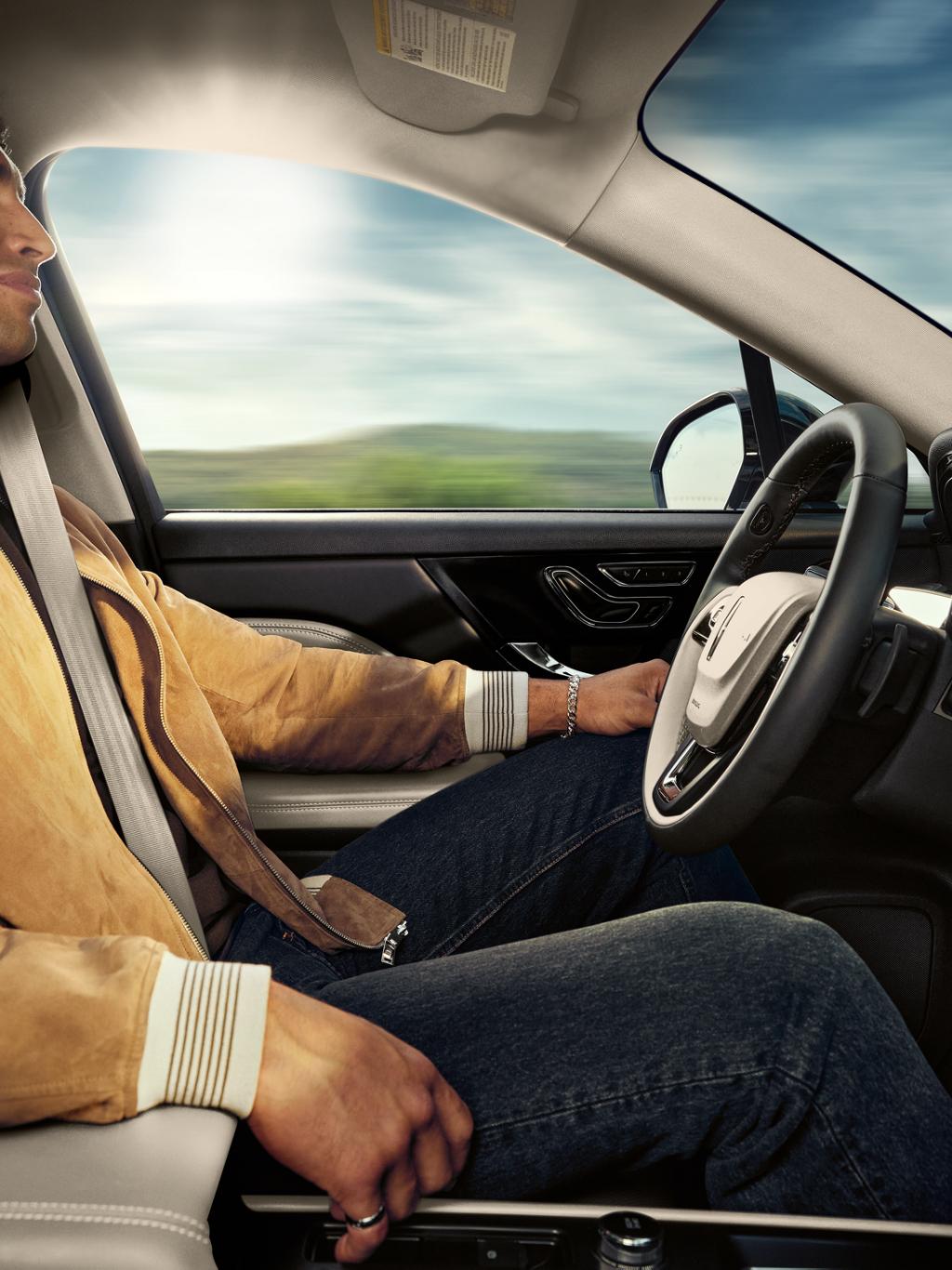A driver is shown seated in a 2025 Lincoln Corsair® SUV while using hands-free controlled access highway driving