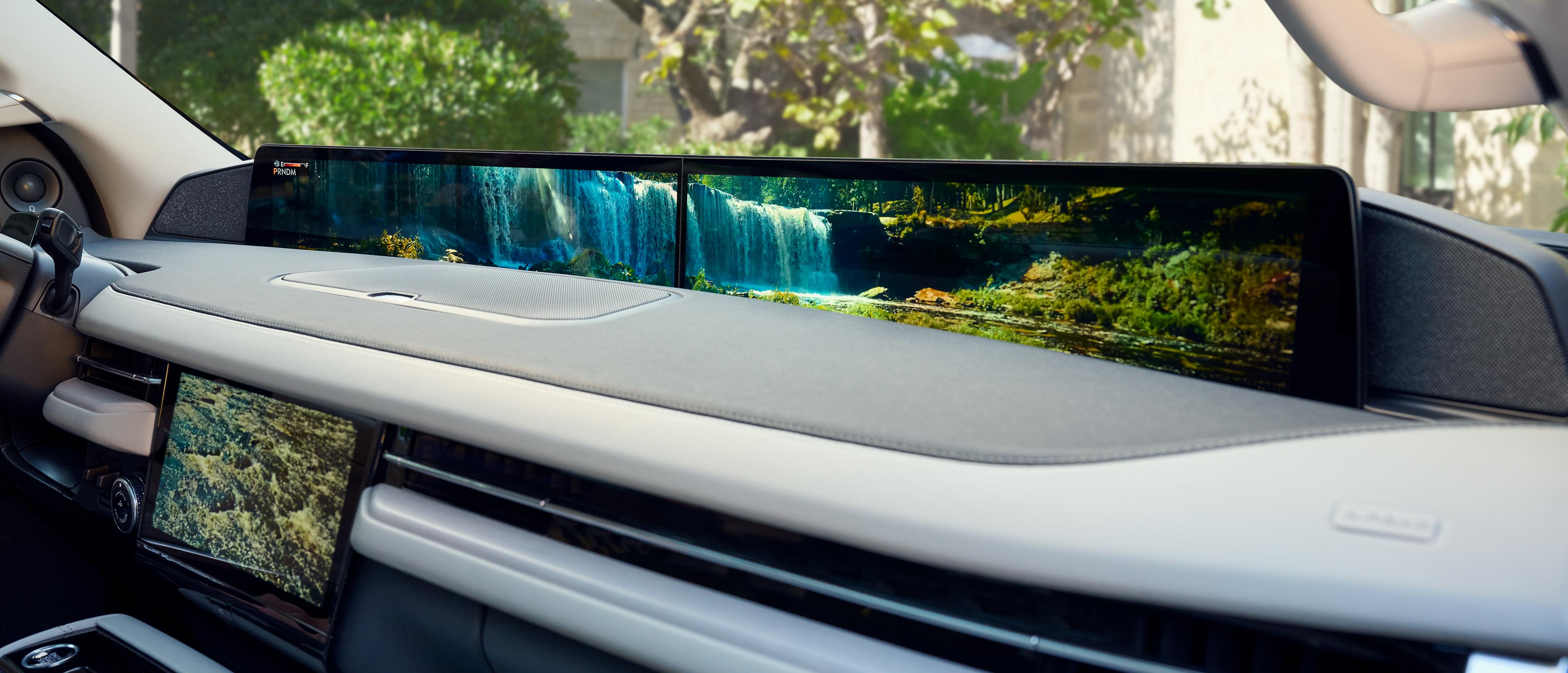 An angled interior shot of the 2026 Lincoln Navigator shows the Waterfall Rejuvenate experience playing on both displays