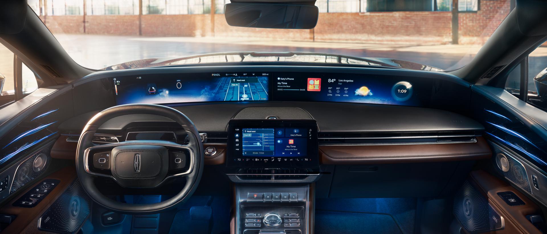 The 48-inch panoramic display is shown in a 2026 Nautilus Reserve with the Hot Chocolate interior