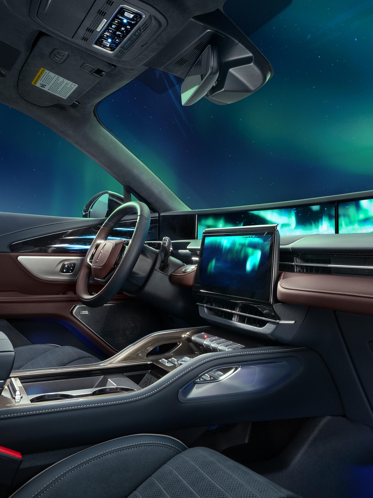 The northern lights seen through the windshield of a 2026 Lincoln Black Label™ Nautilus® SUV with the Aurora interior theme