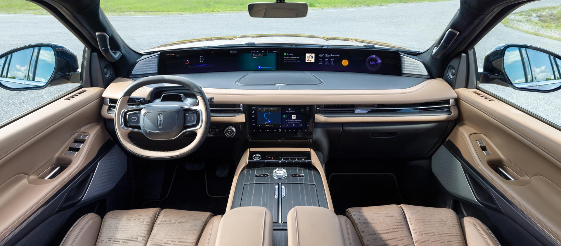 The interior of a 2027 Lincoln Navigator® Black Label™ SUV plays host to a dramatic panoramic display